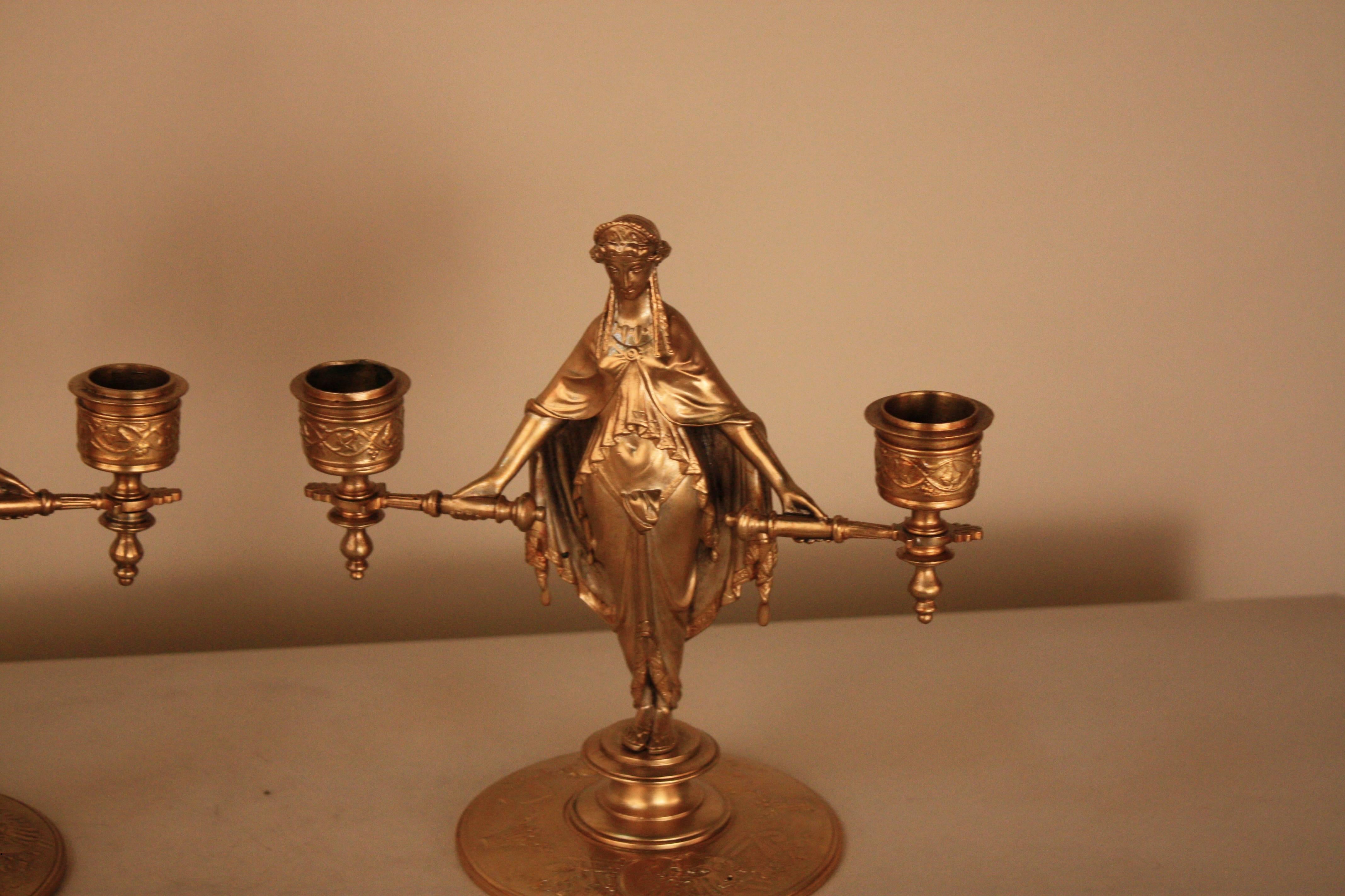 Pair of 19th century French double arm Empire style bronze candelabra.