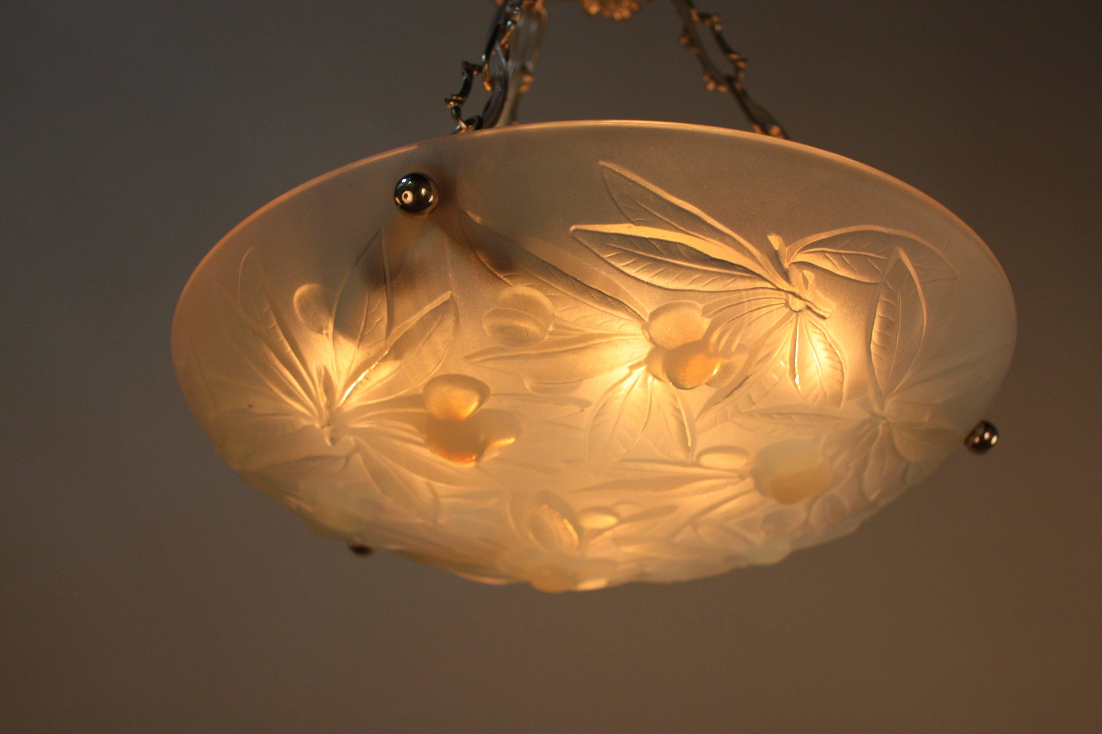 A design of leaves and fruit, opalescent glass chandelier by Vernox which another trade name that Sabino used only in the 1930s.
Nickel on bronze hardware, six lights 60watt each.