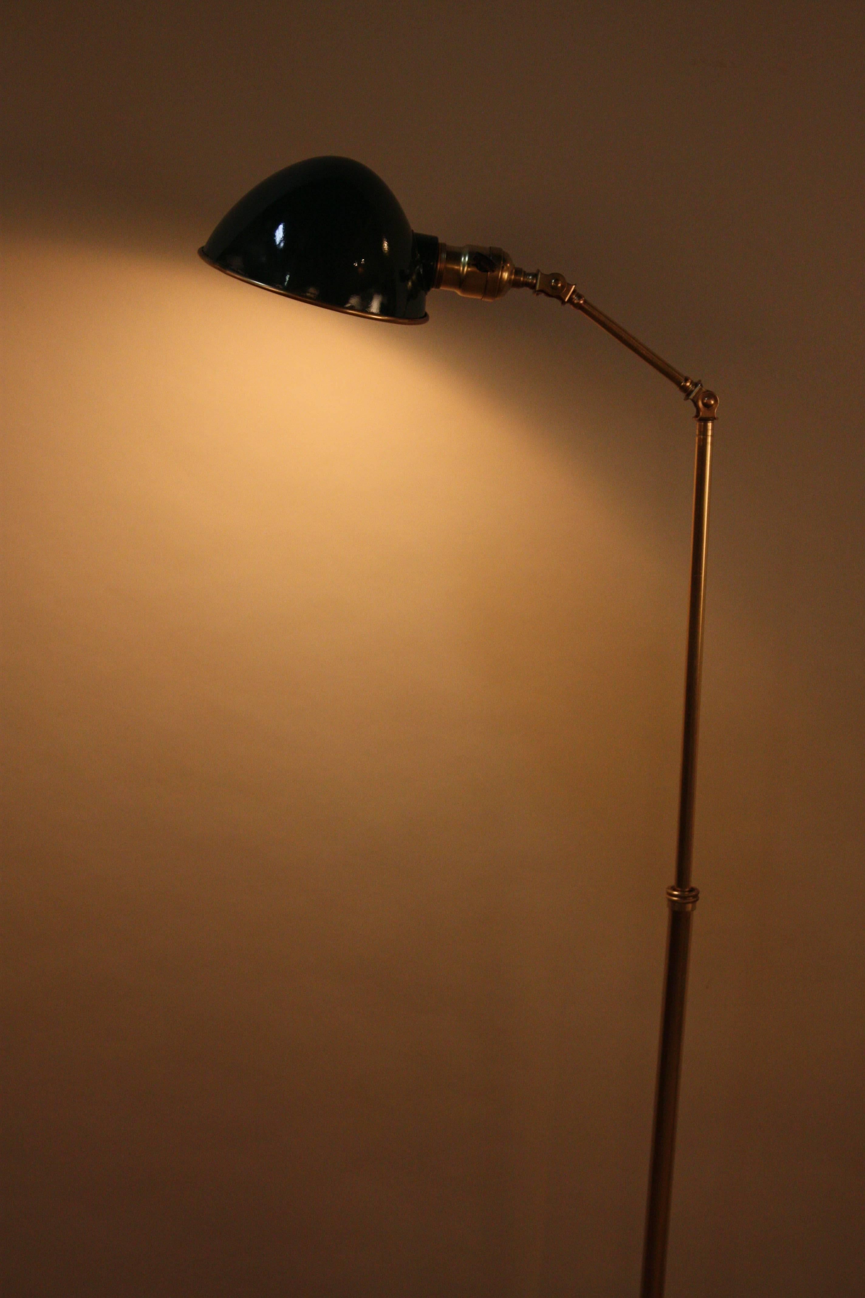 Industrial adjustable height, arm and shade with articulating joint brass floor lamp that was designed and fabricated IN 1920s by the Faries mfg. co.