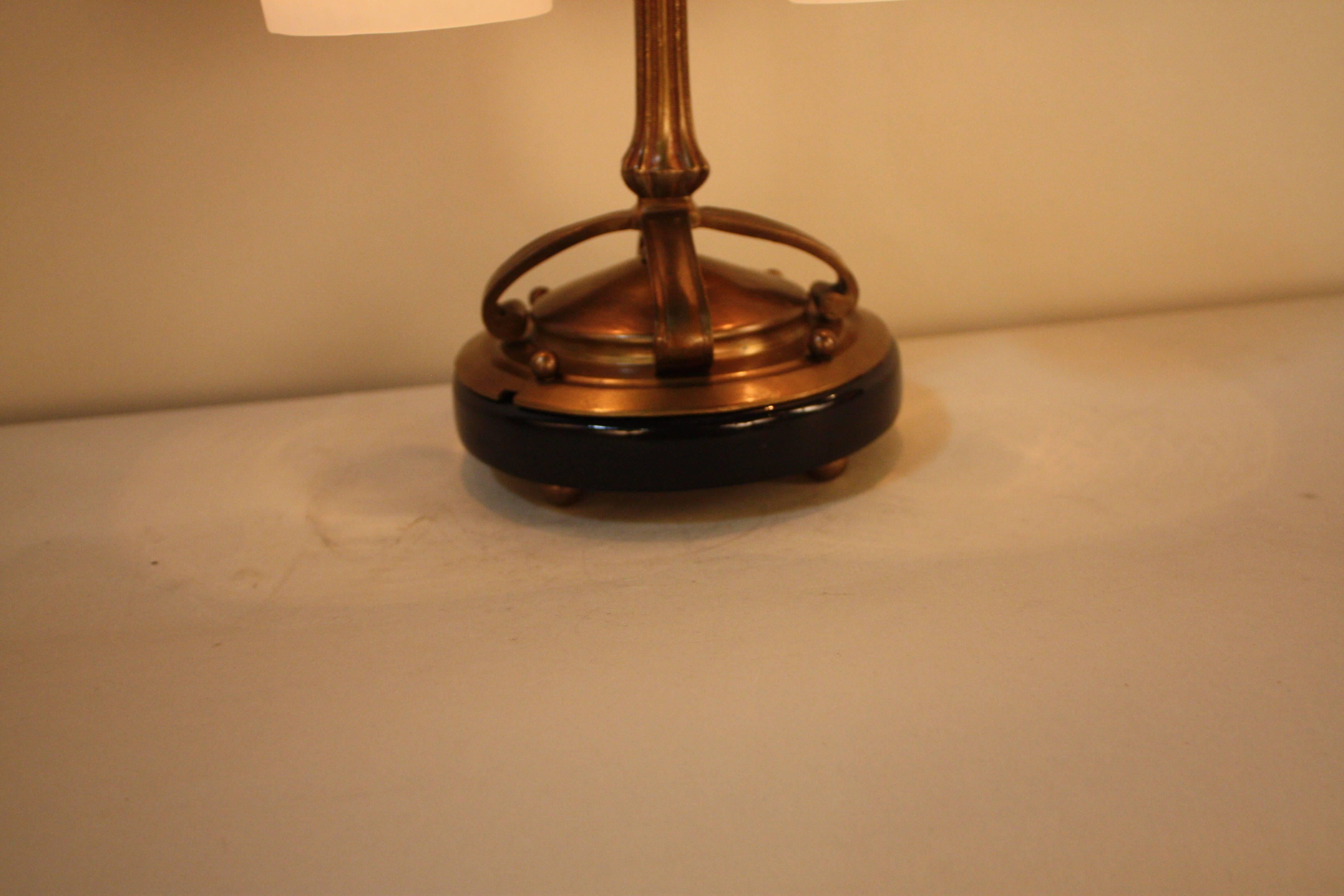 A beautiful double light blown art glass shades with bronze and marble base table lamp.