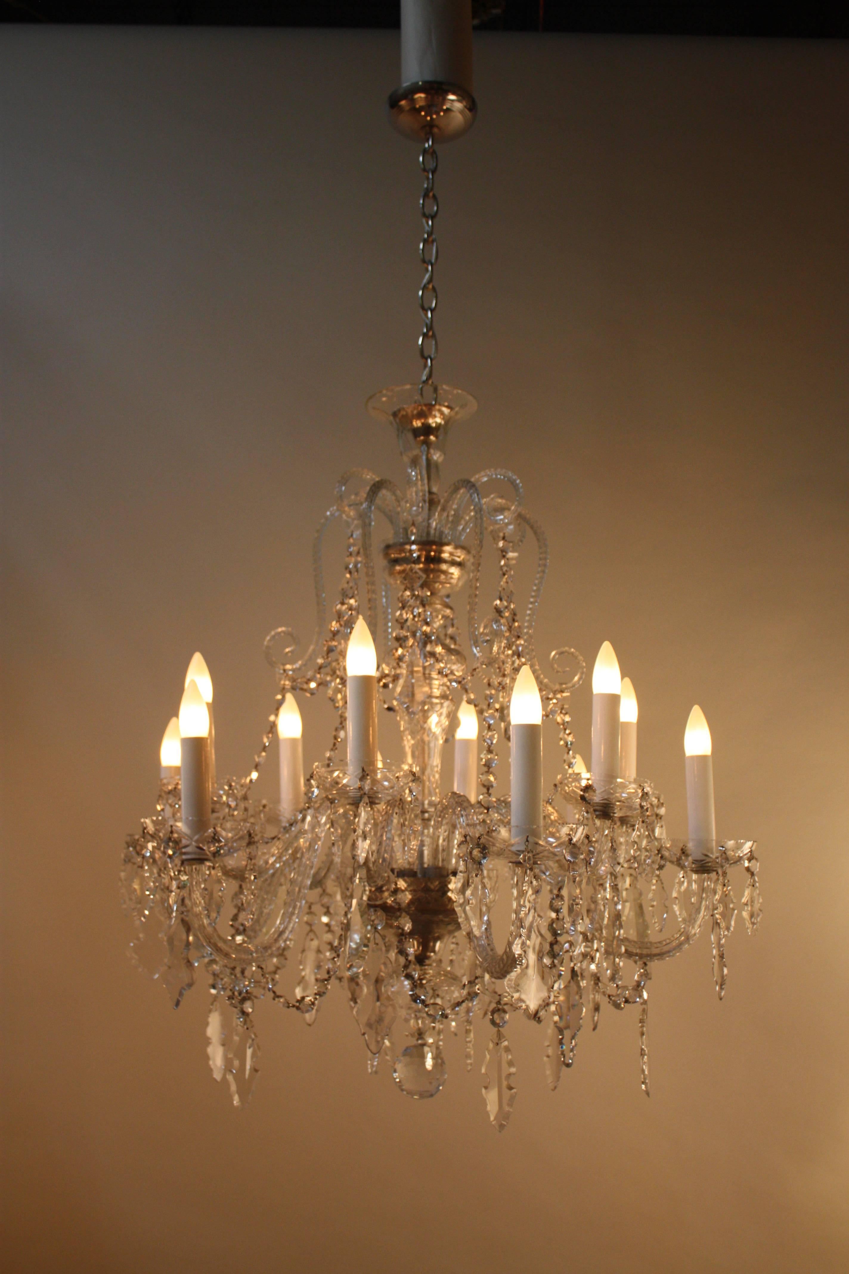 A fantastic 12-arm high quality hand-cut Spanish crystal chandelier. This chandelier is 31