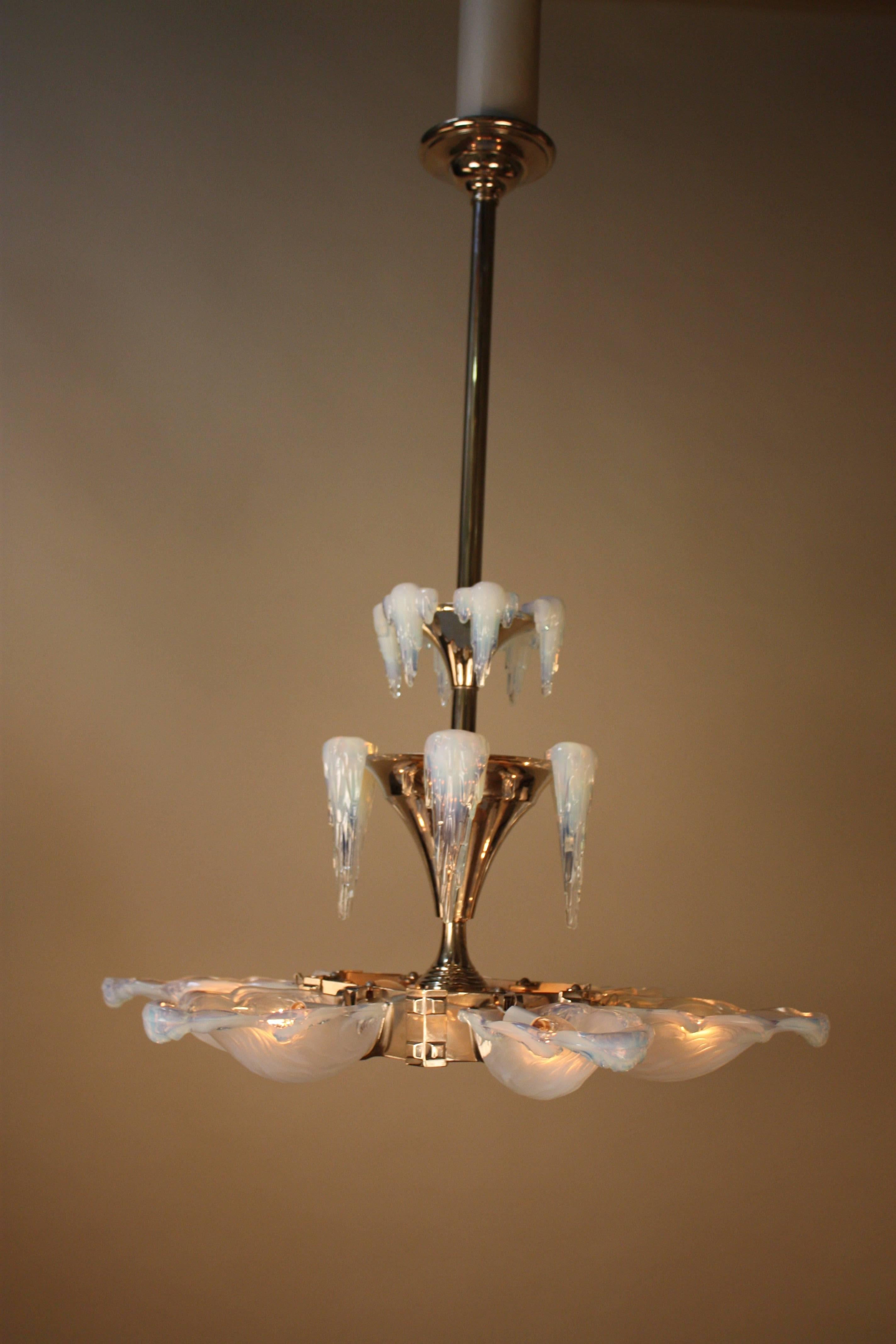 French Art Deco nickel on bronze and opalescent glass chandelier in the form of a frozen water drip. The center glass is clear frost with star and rainbow etching.