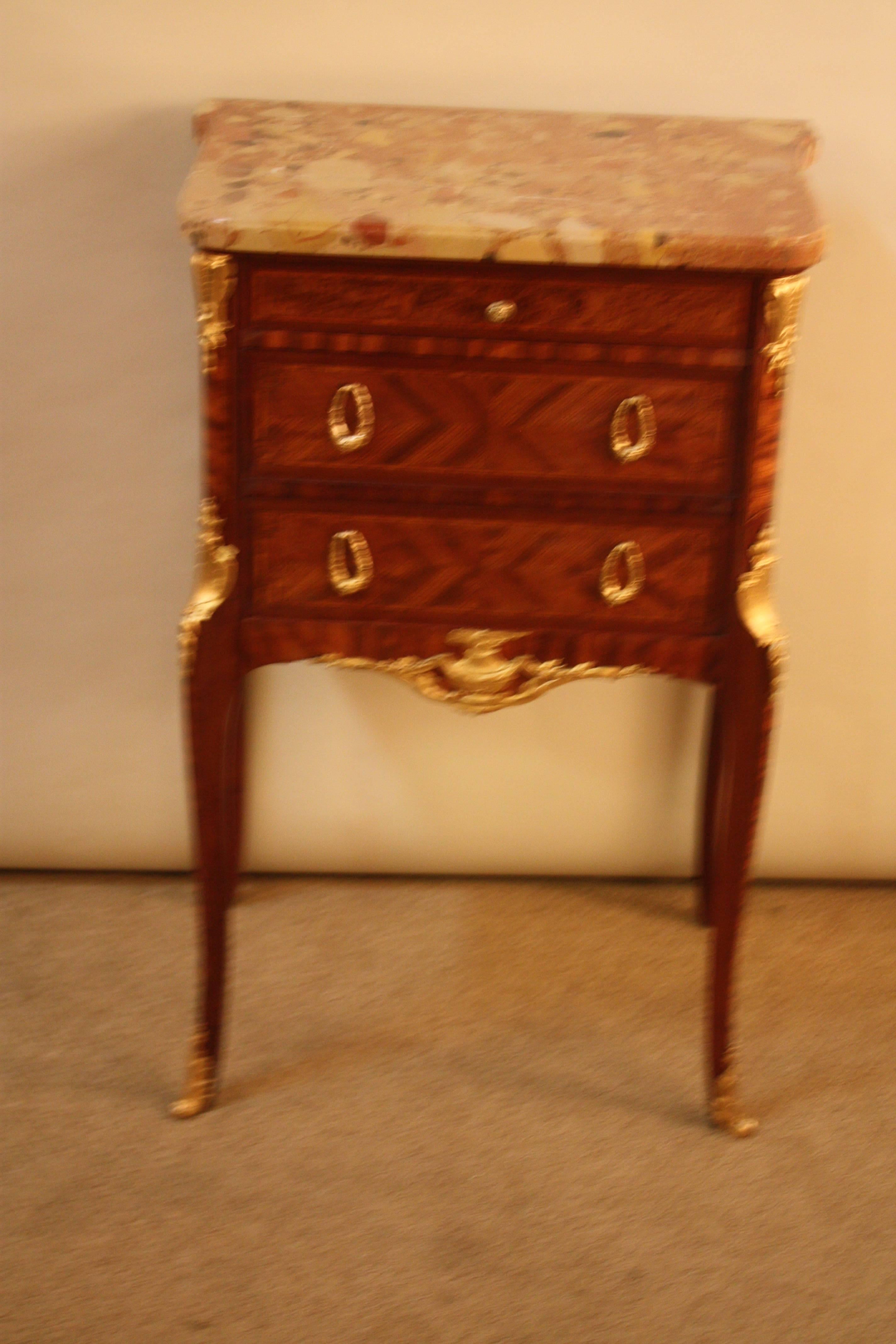 French 19th century inlaid wood and marble top side table. This table features finely cast bronze neoclassical design decoration with marble liner.