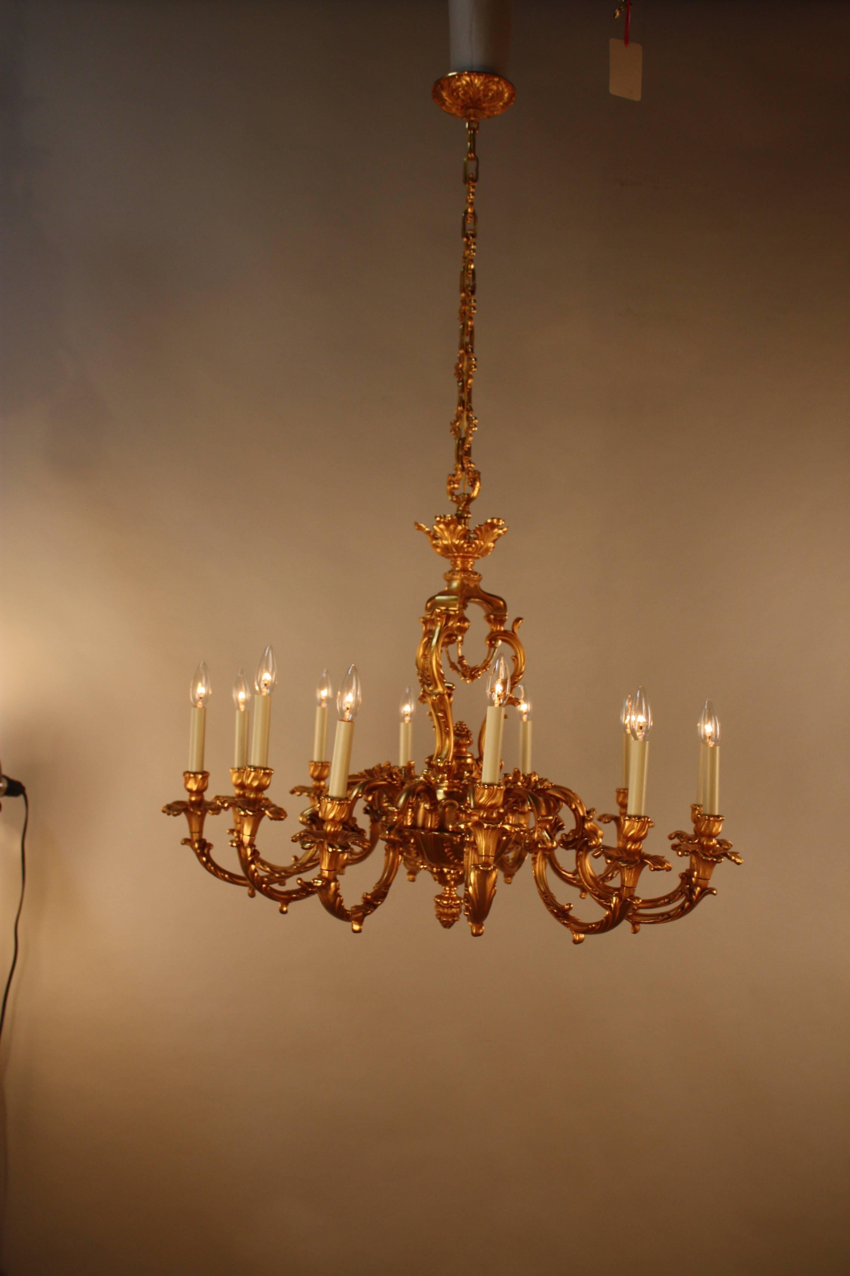 Pair of doré bronze twelve-light Louis XV style chandelier.
35' wide 36