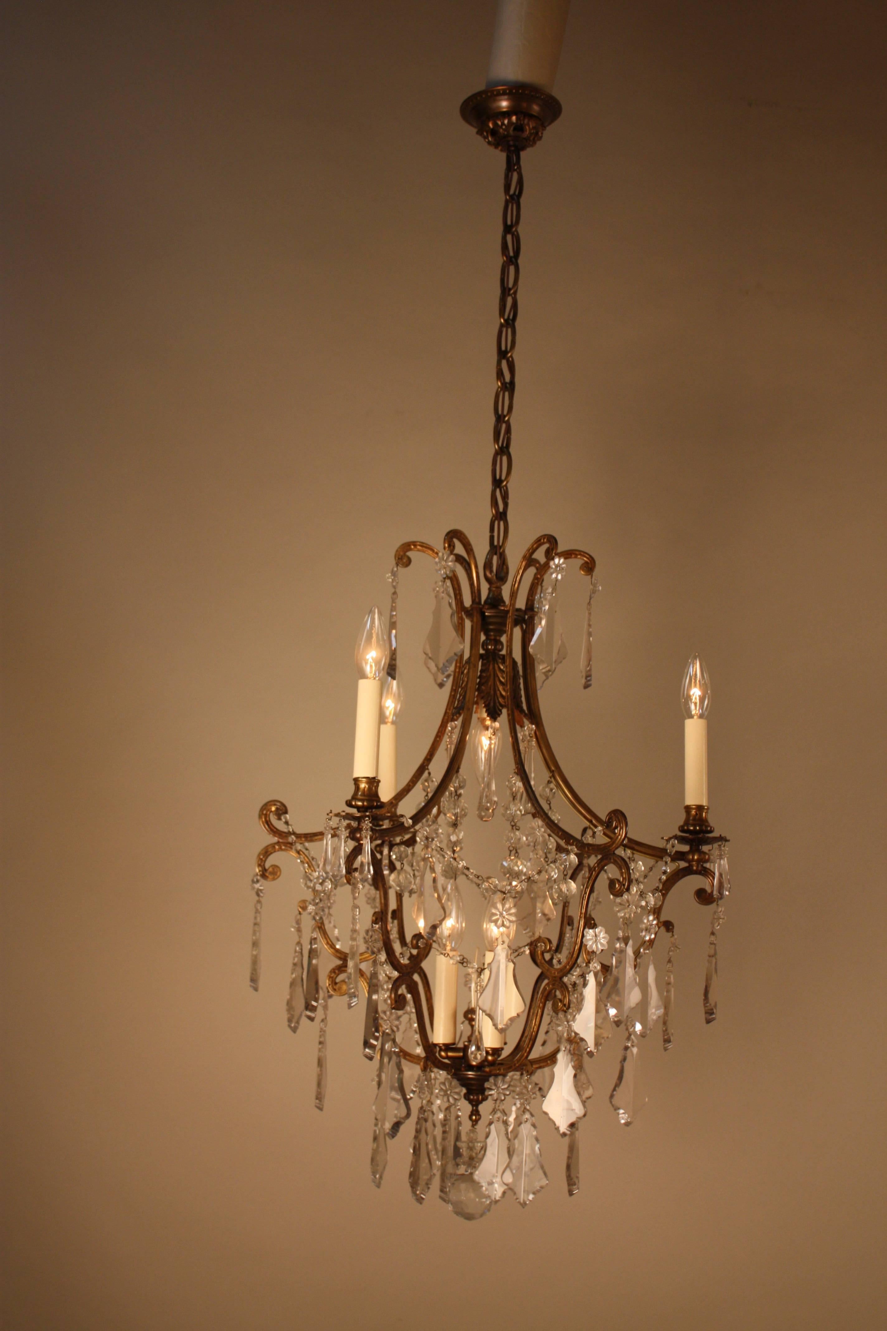 Elegant Spanish, 1930s seven-light crystal and bronze chandelier.
The total height of this chandelier with all the chain is 46