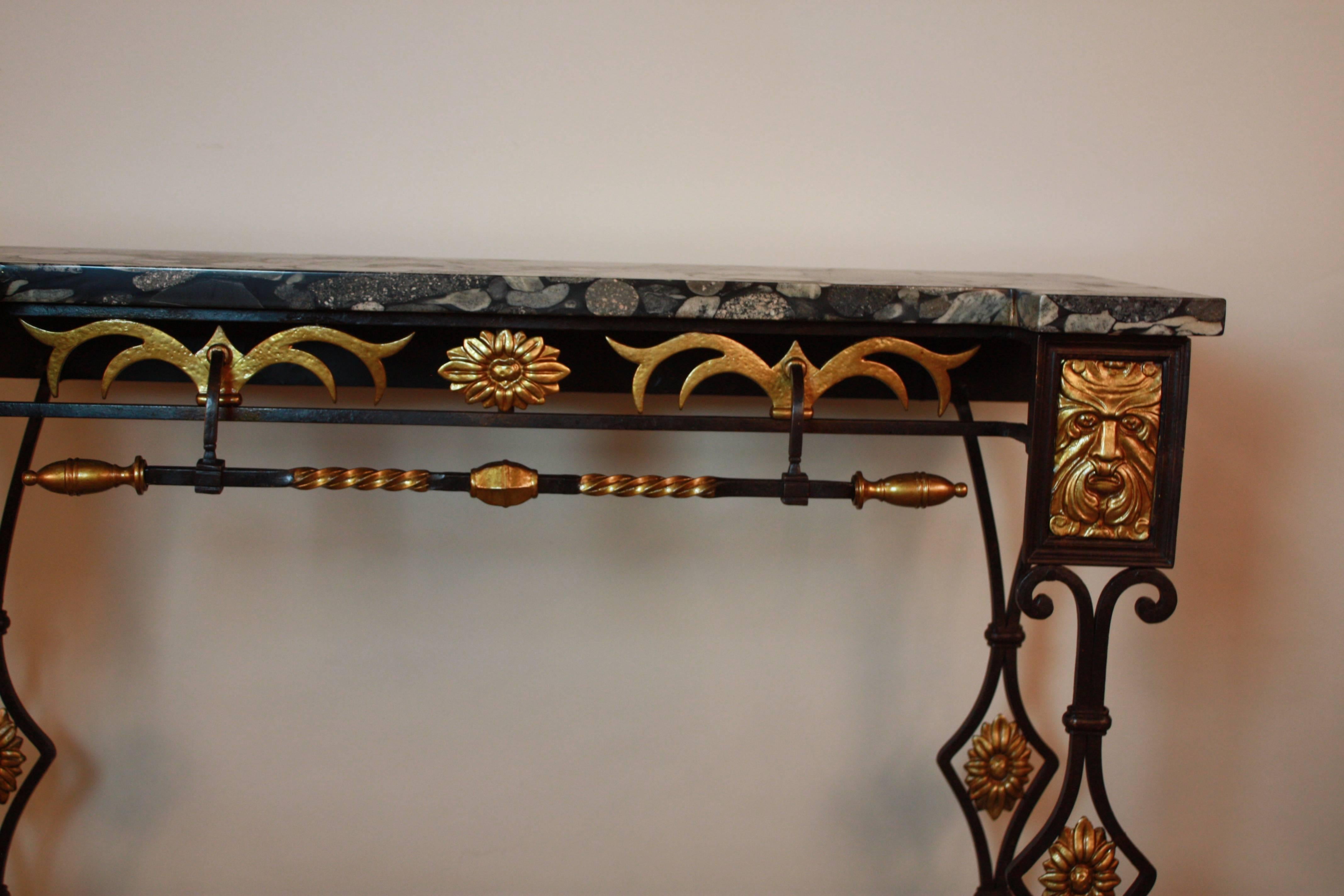 Classic design marble-top combination of cast bronze and iron console.