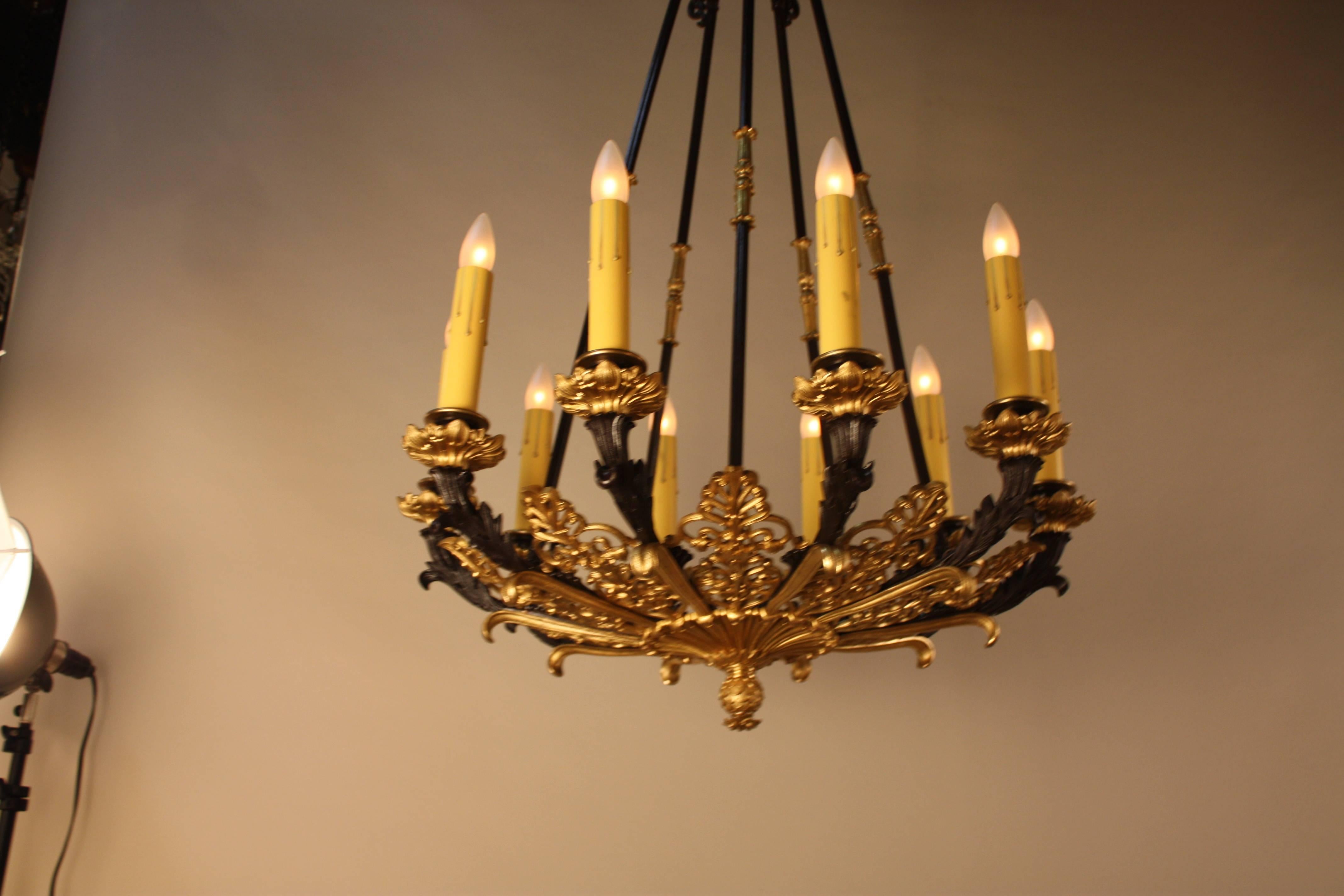 French 19th century in two color bronze Empire style chandelier.
This chandelier has total of ten lights with 60 watts max each light.
This chandelier has two canopies 37.5