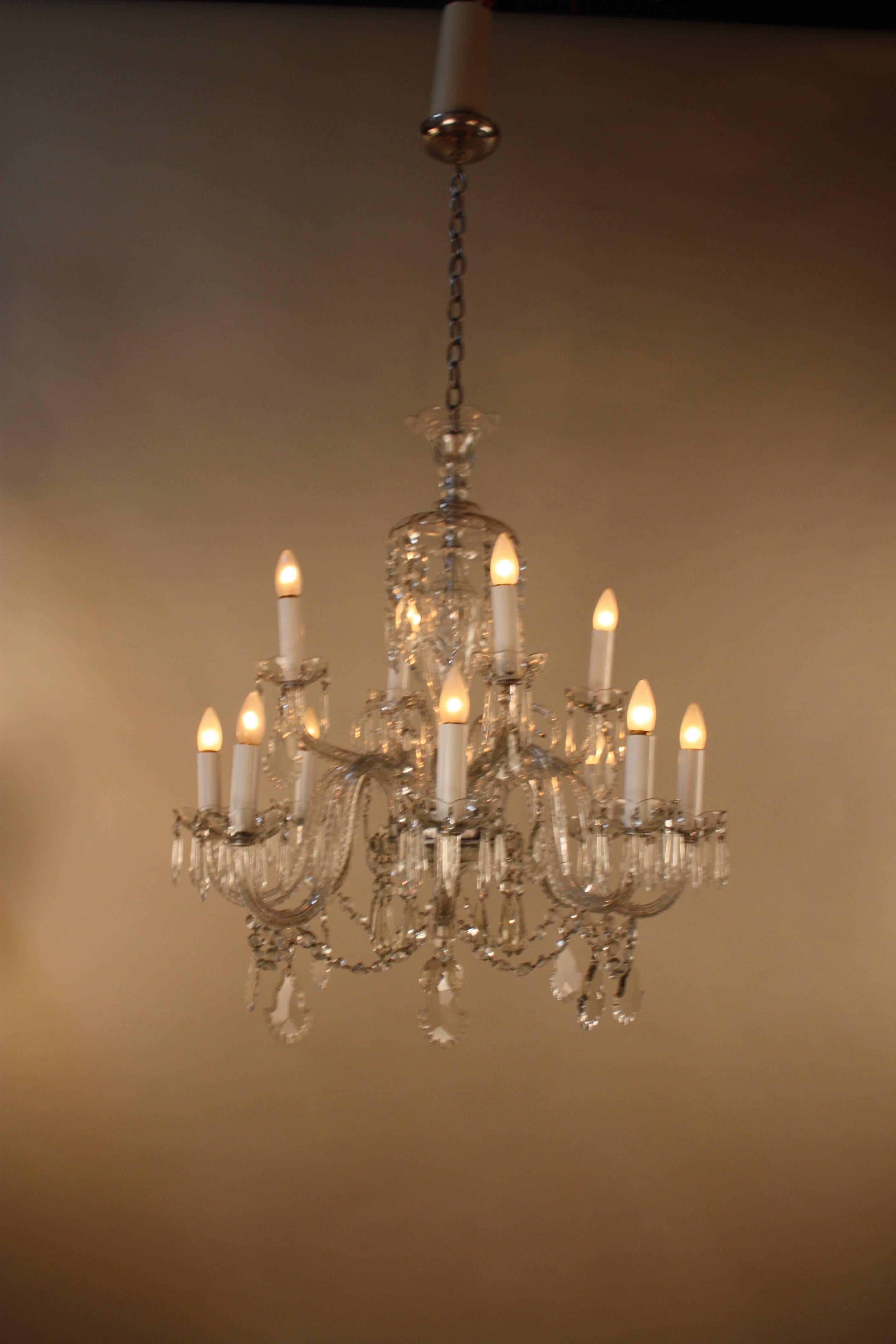 A beautiful 12-arm high quality hand-cut Spanish crystal chandelier. This chandelier is 32