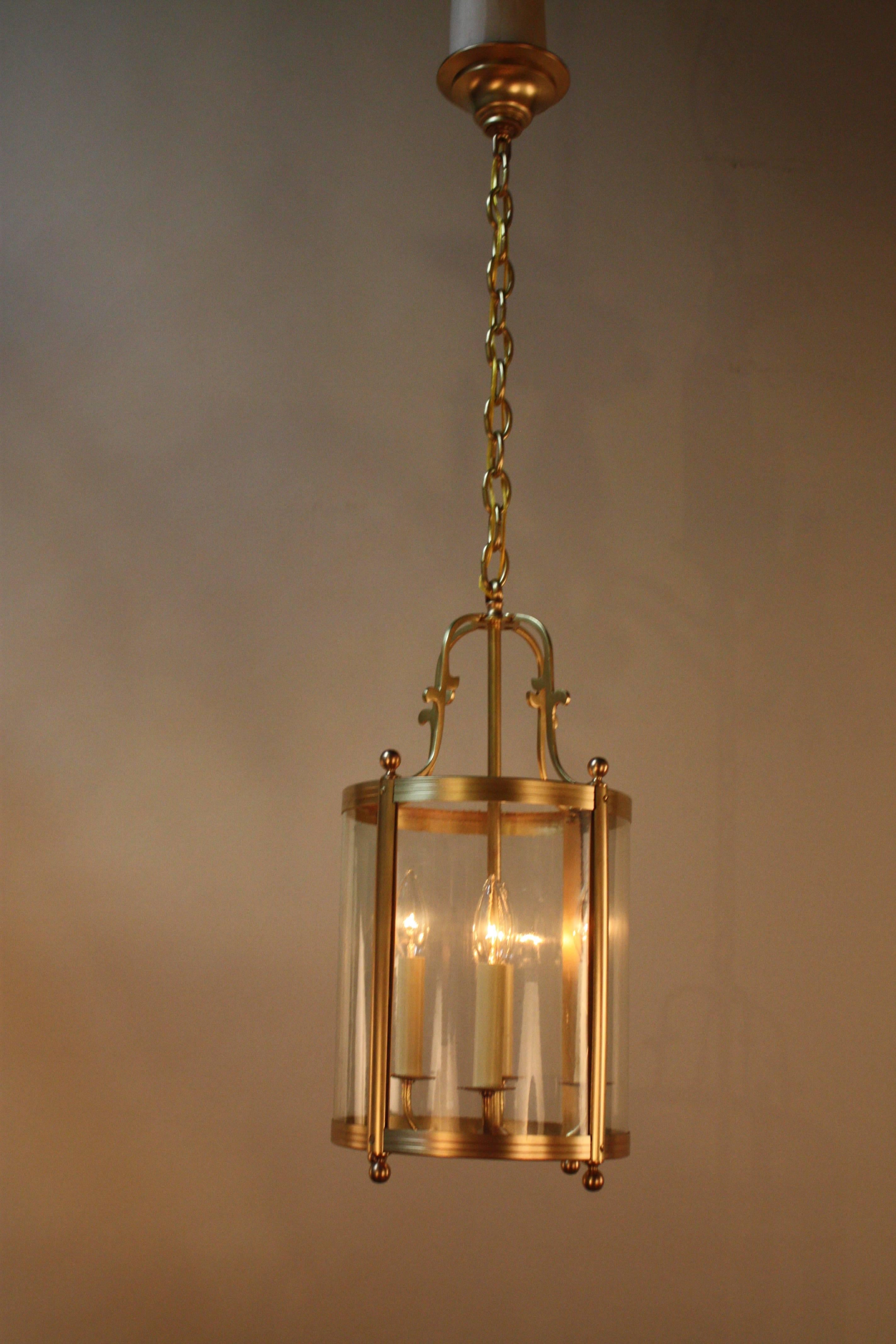 Elegant 1920s four-light bronze and hand bent glass (has small bubbles in the glass copy of 18th century glass) lantern.