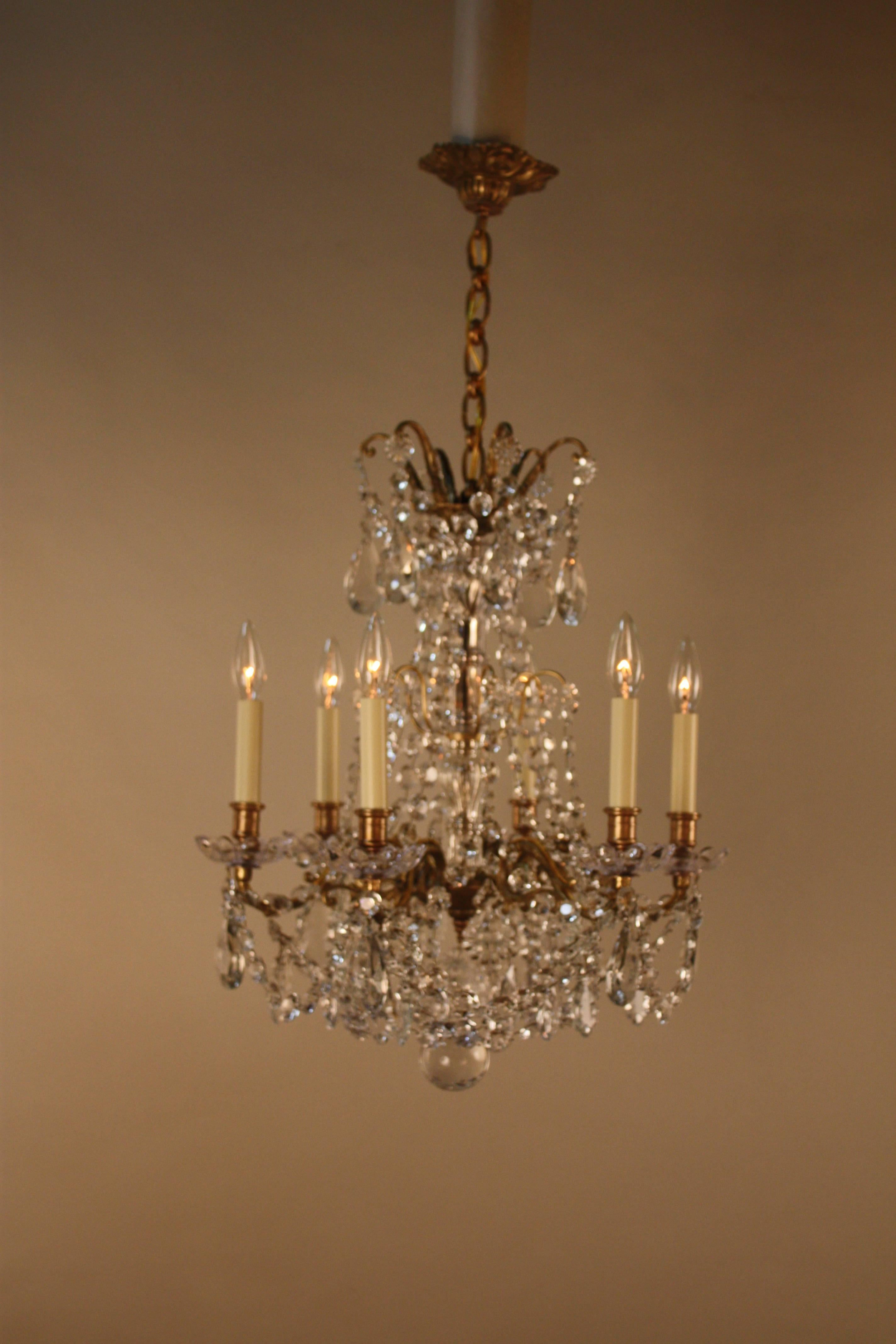 Early 20th century six-light bronze and crystal chandelier.