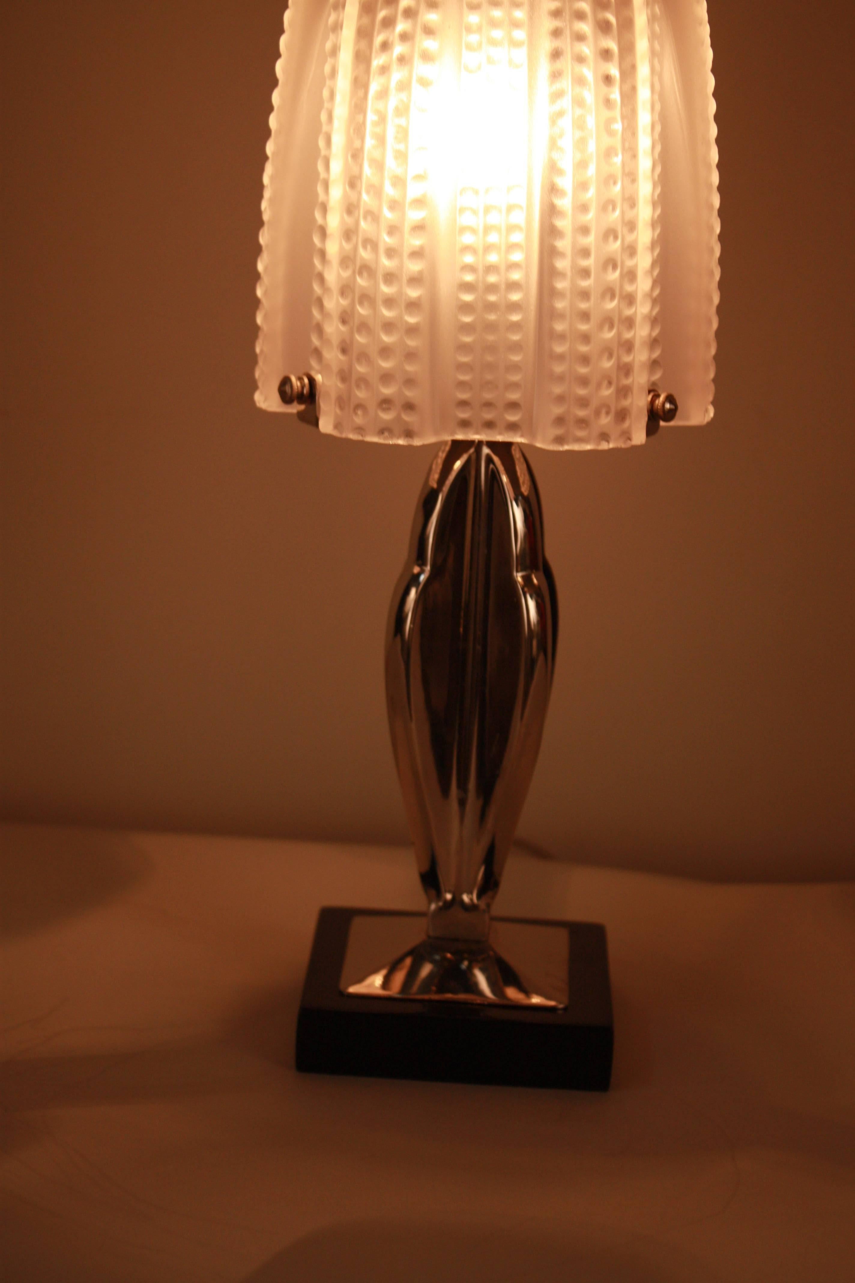 Frost glass with high light polish, polished nickel base over marble table lamp.