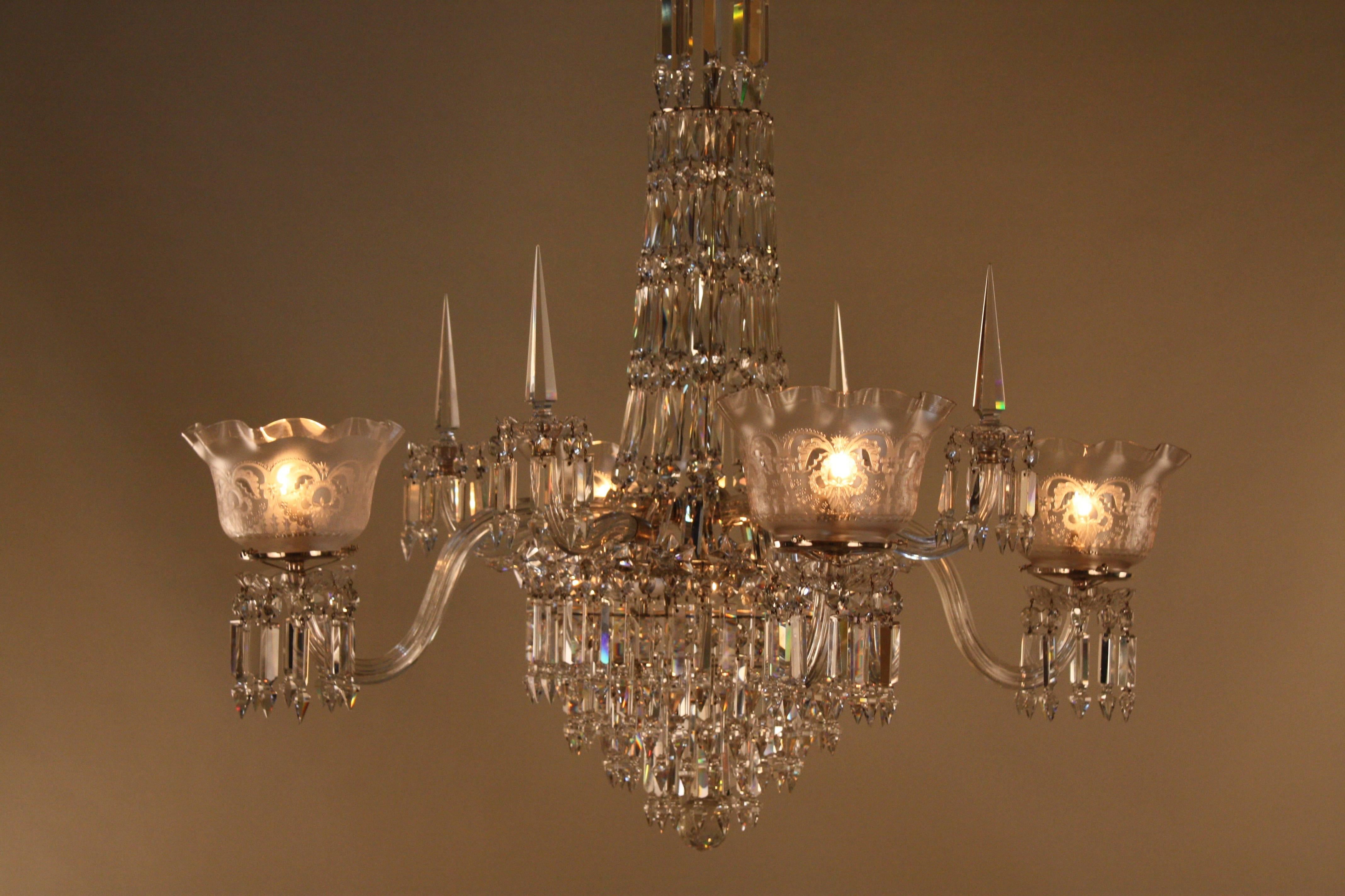 American 19th century four-arm hand polished crystal gas chandelier.
This chandelier has been professionally electrified.
Additional of three light has been added to the center of the chandelier which can be removed.