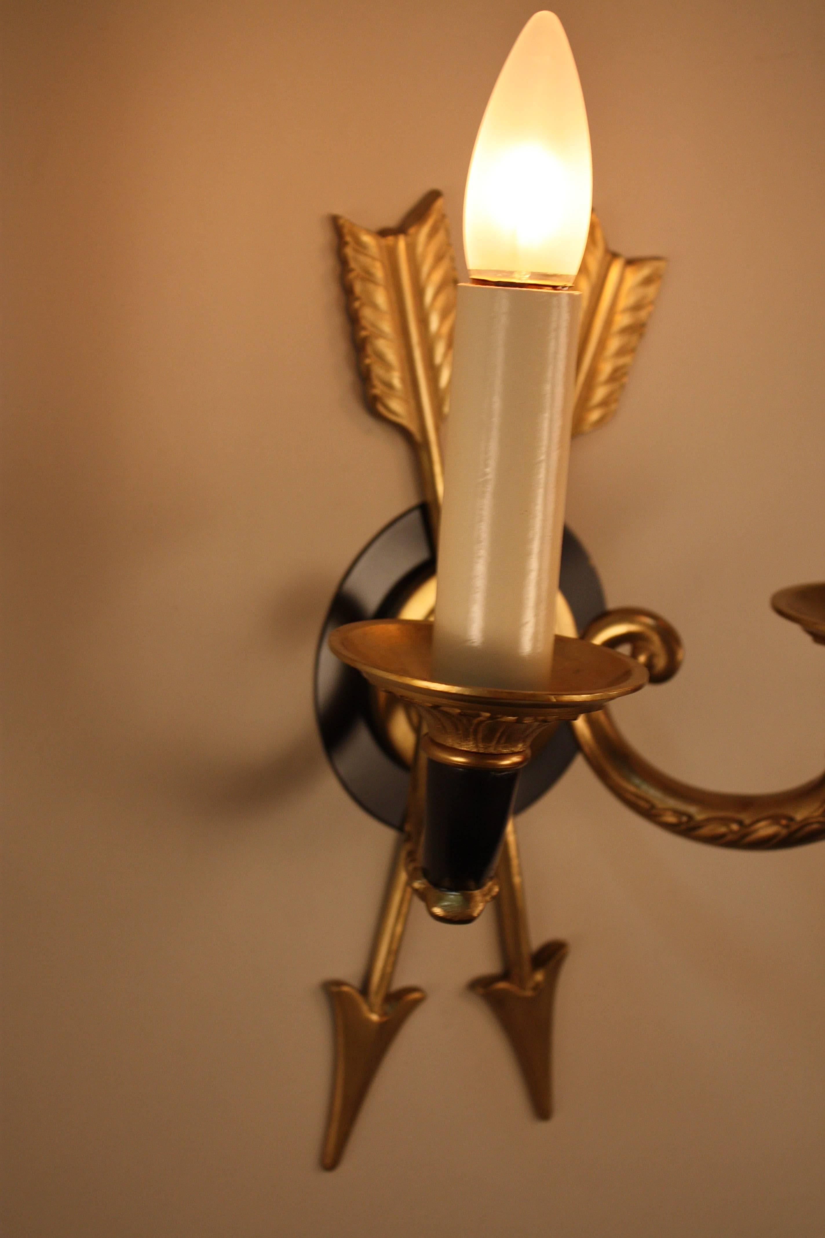 Empire style set of seven double arm bronze wall sconces.