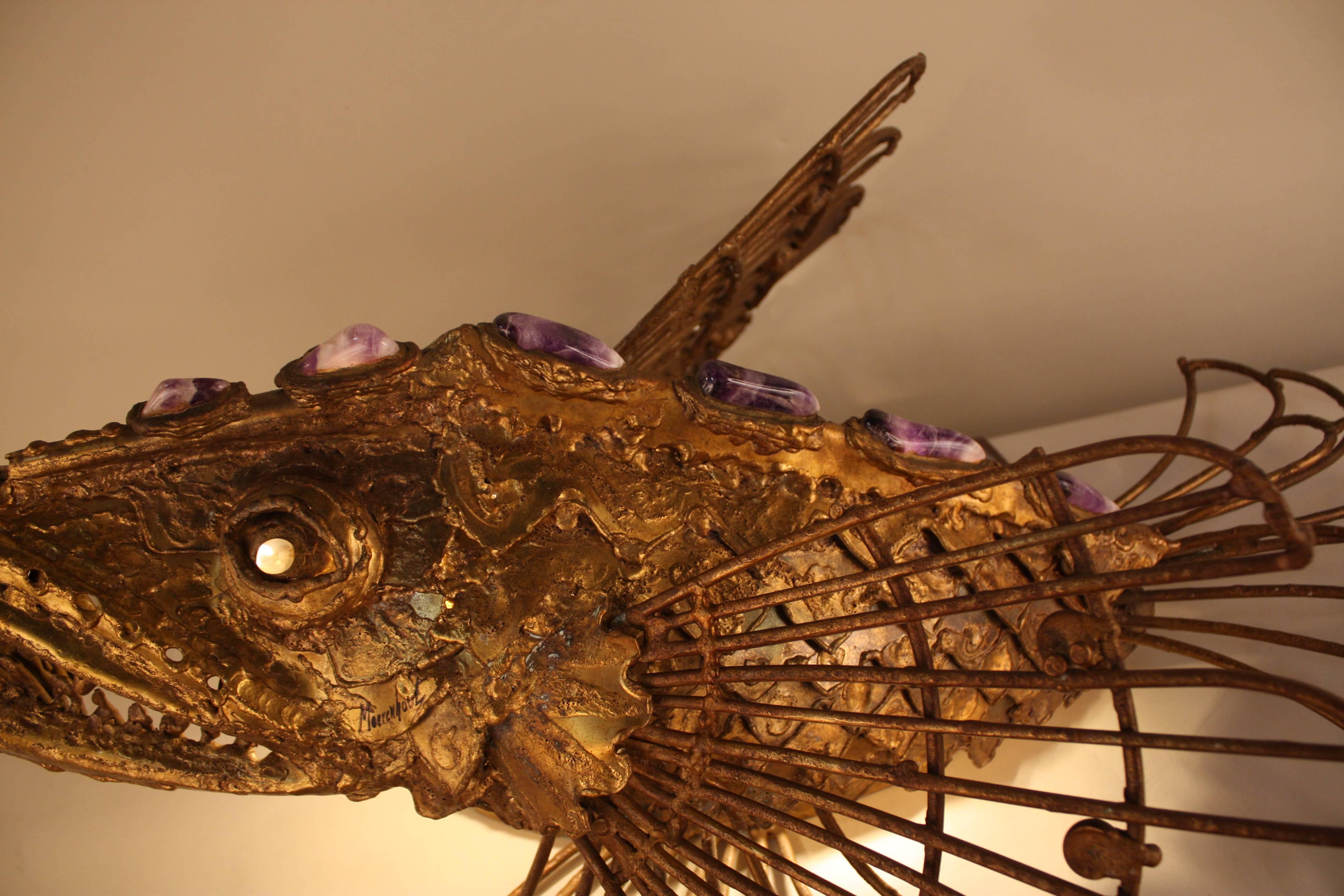 Wild fish design bronze sculpture with amethyst rock that can be used as a table lamp or wall sconce. by Paul Moerenhout.
Measurement is done as a table lamp.