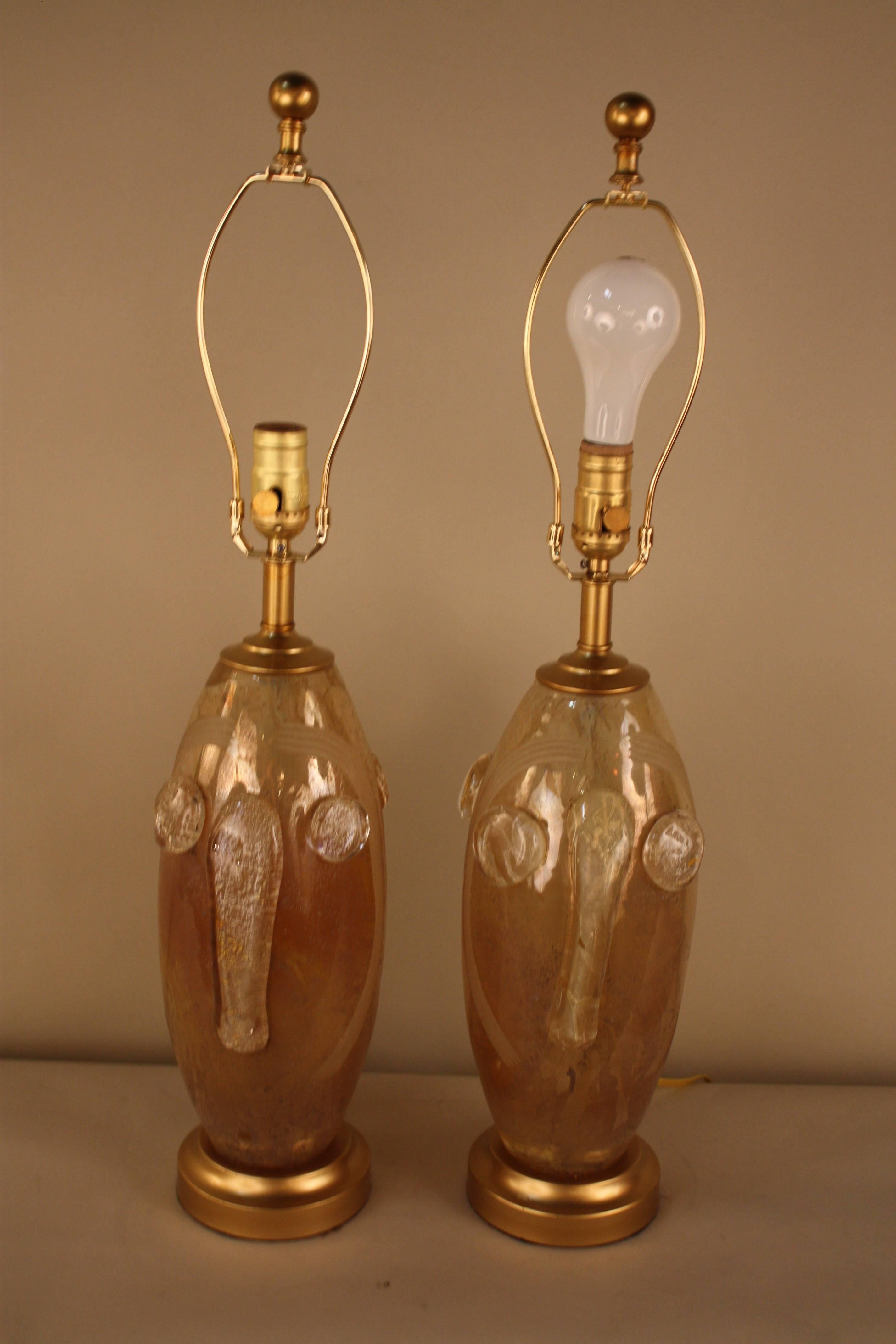 Pair of handblown glass that have been customized to beautiful table lamps and fitted with silk hardback lampshades.