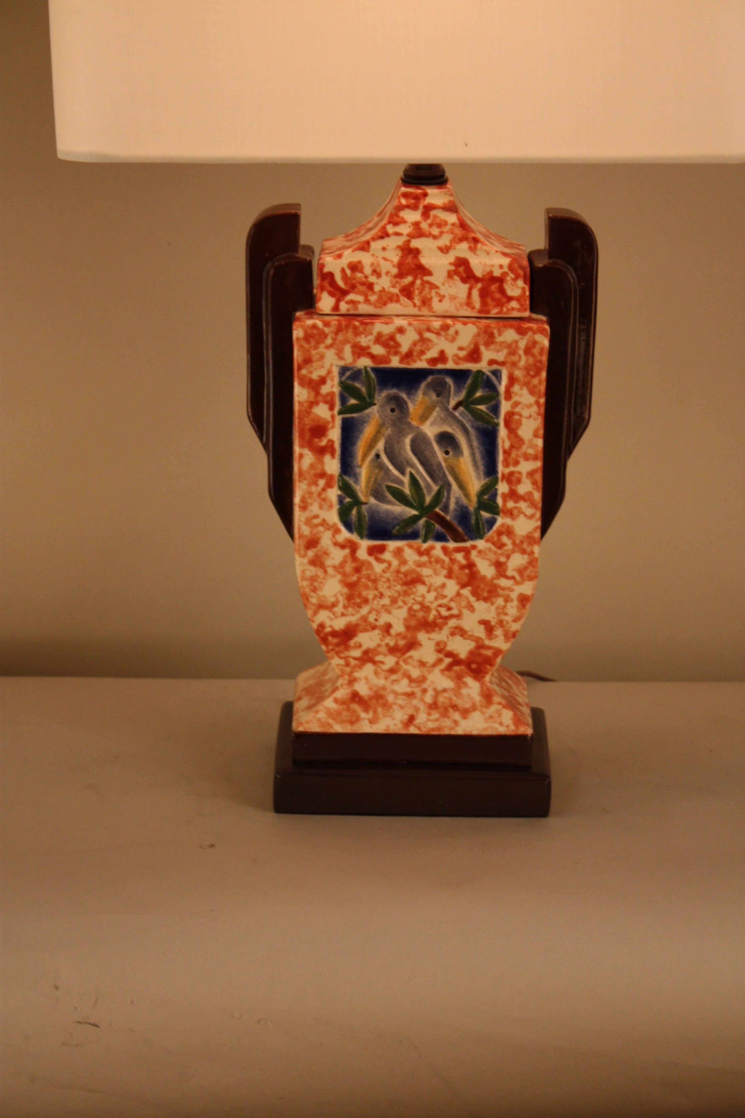 Pair of 1930s English Art Deco pottery table lamps.
Fitted with hardback silk lampshades.