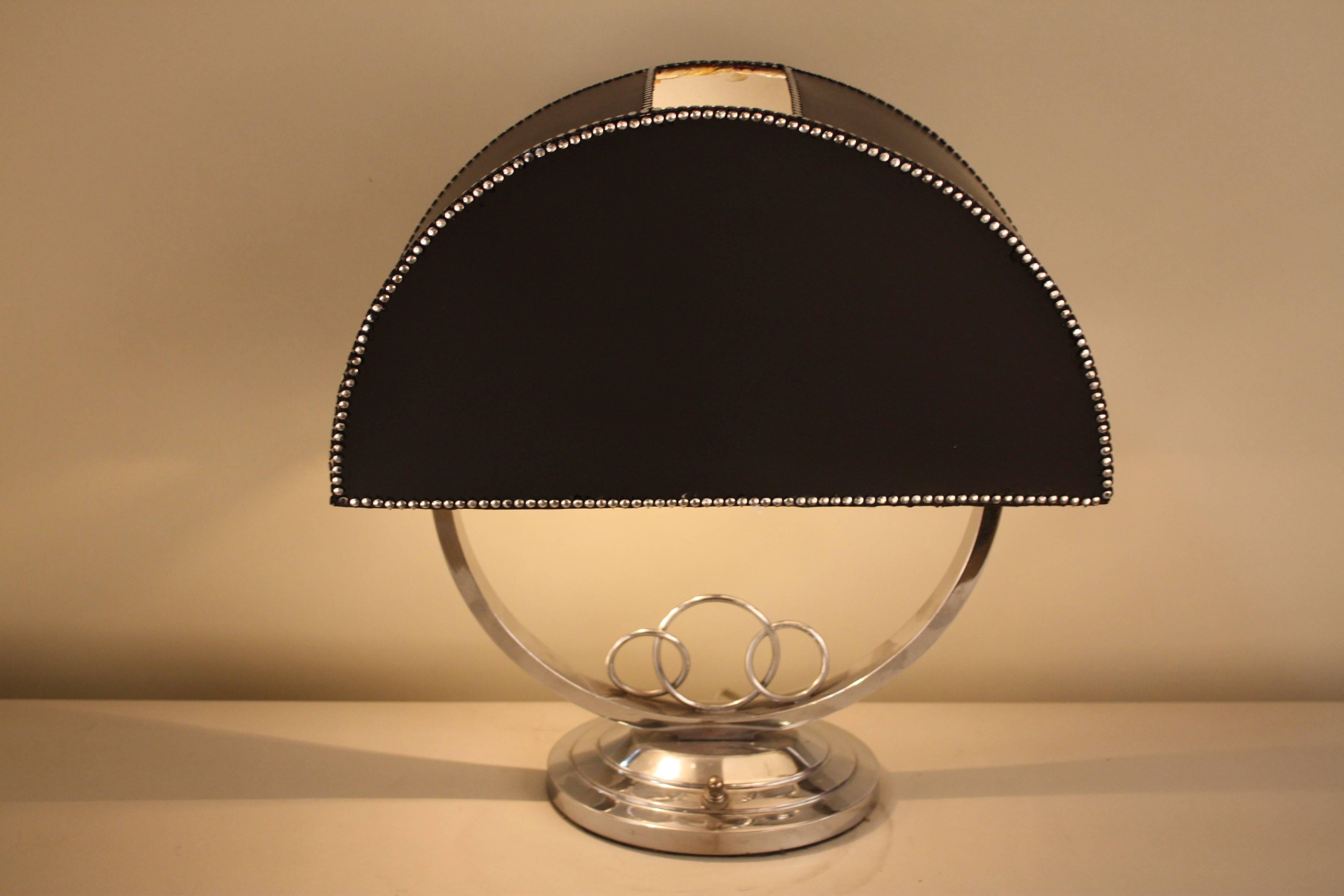 French Art Deco desk lamp in nickel on bronze base and half round black lampshade.