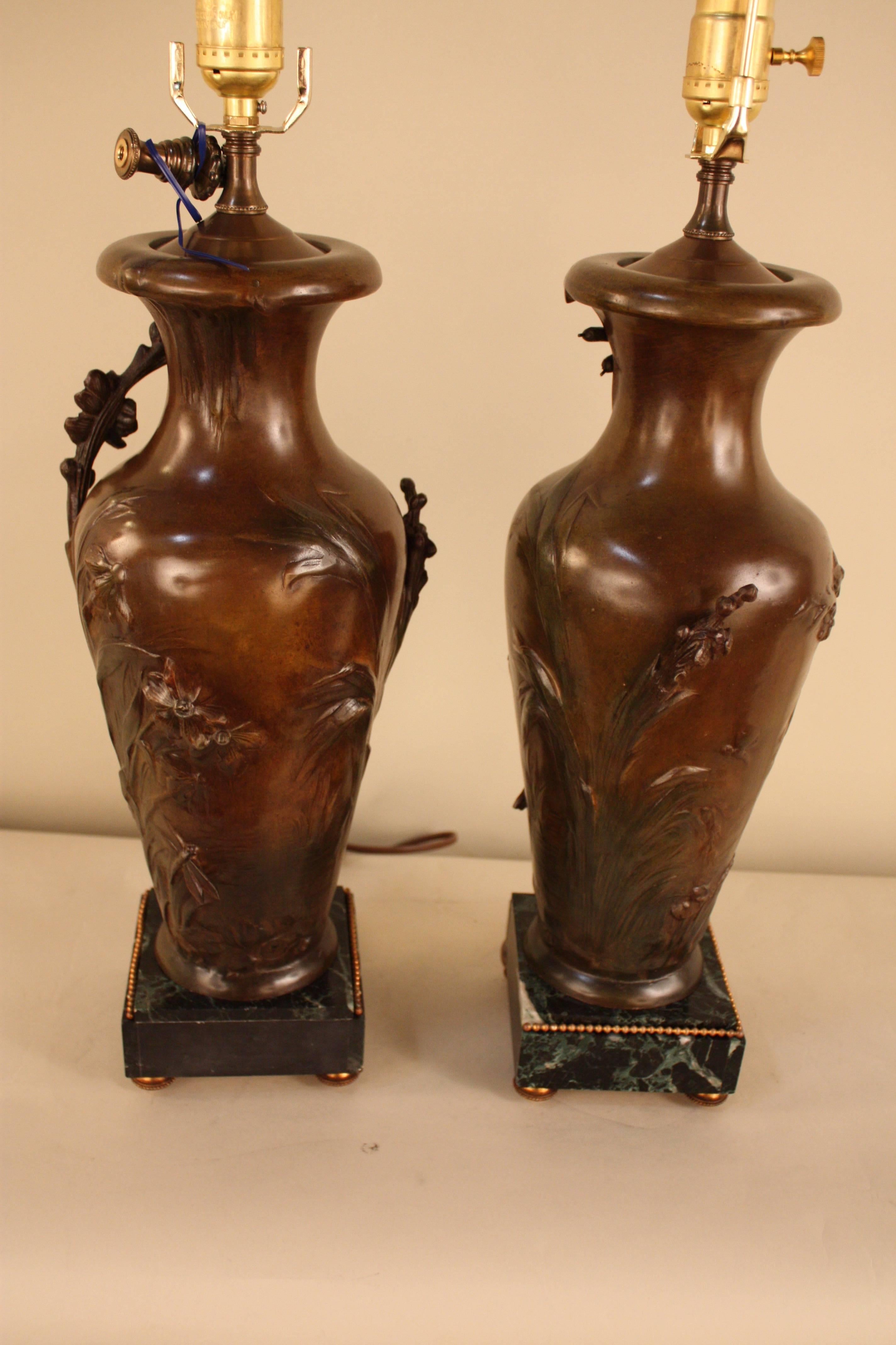 Pair of flora Art Nouveau urns that electrified as table lamps by Auguste Moreau and Fabrication Francaise Paris.