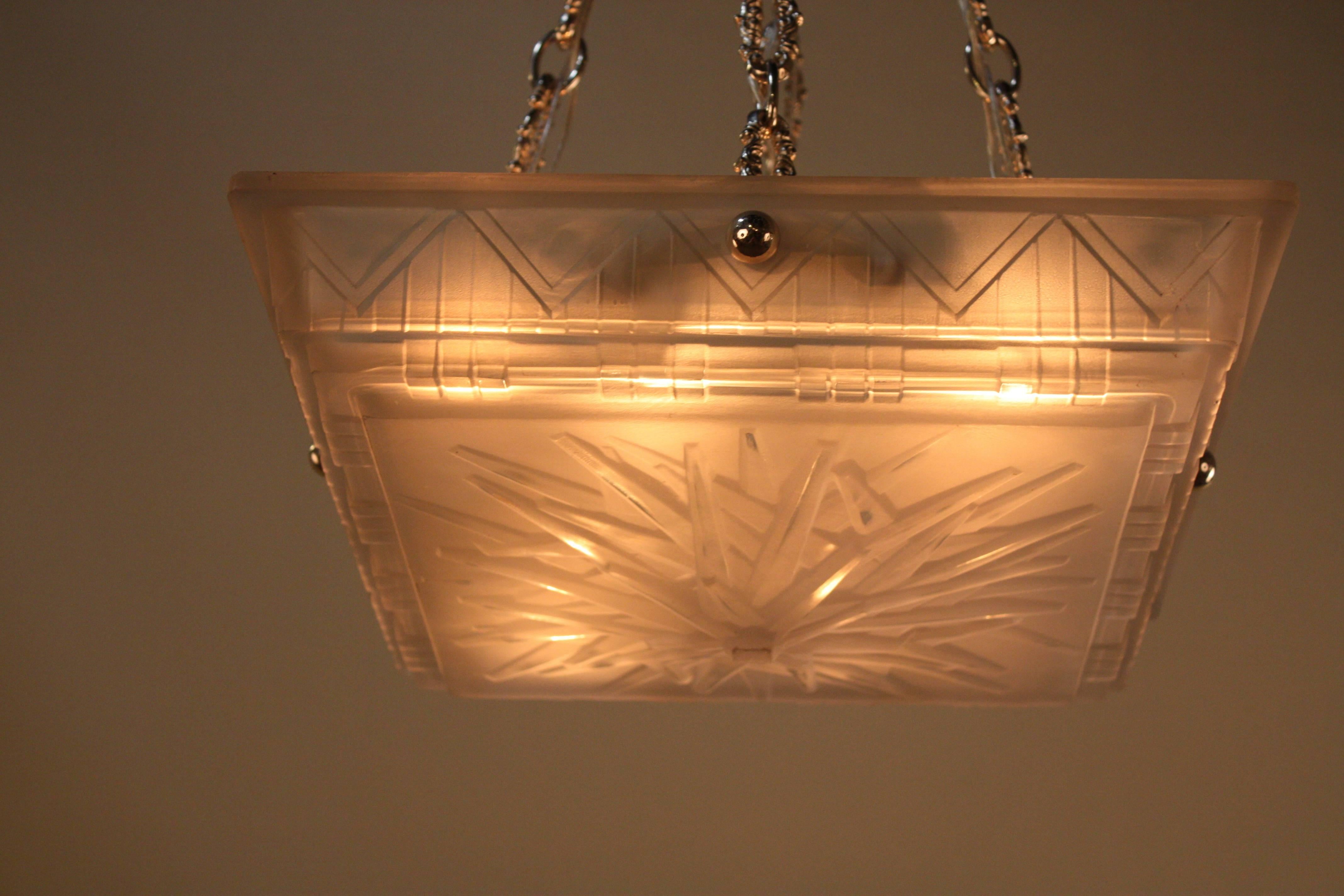 Square Art Deco chandelier with total of eight-light and nickel on bronze chain and canopy.