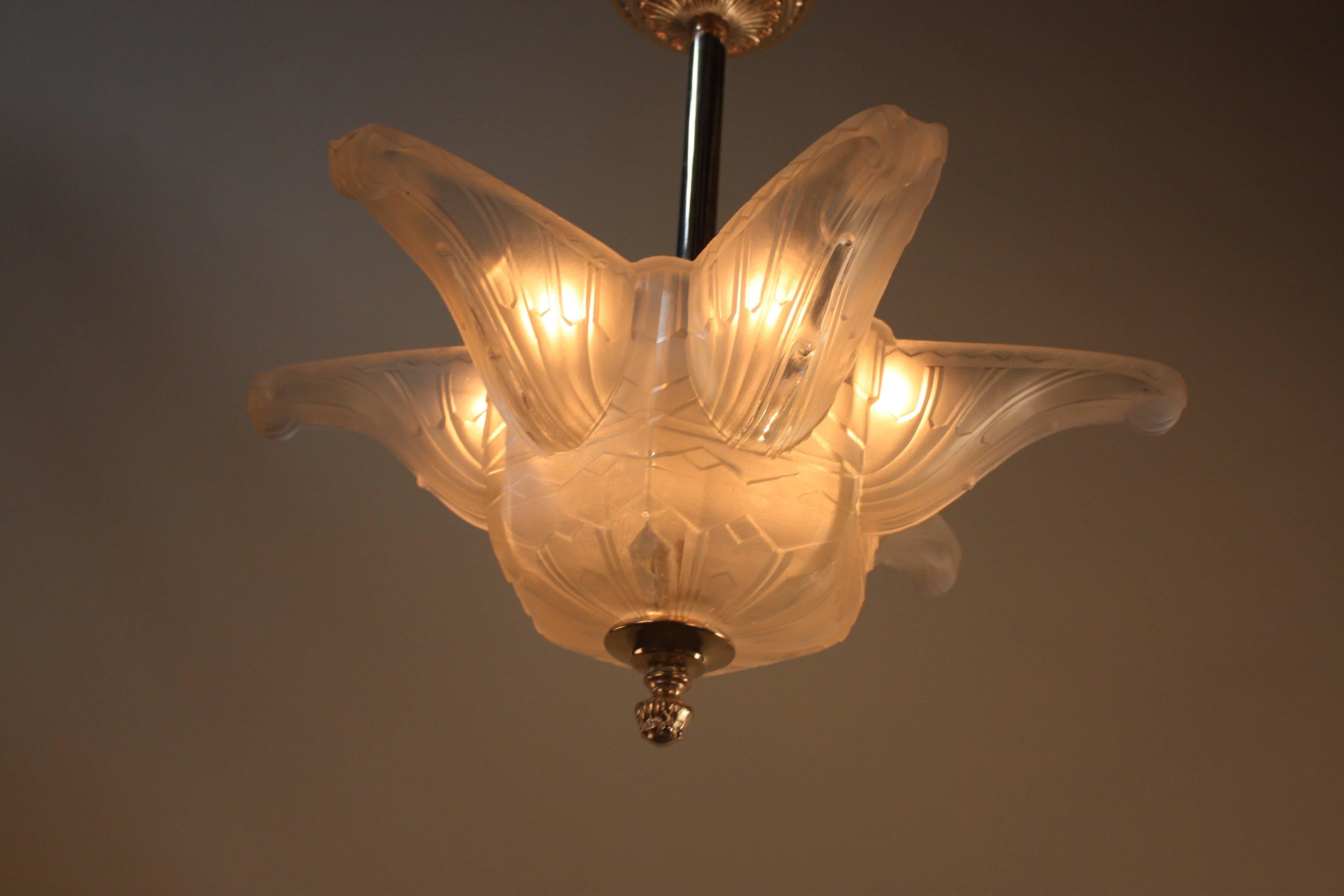 An elegant French Art Deco chandelier by Verrerie des Hanots. Total of six-light with nickel on bronze canopy and hardware.
If you desire shorter height we will be glad to adjust the rod for you.