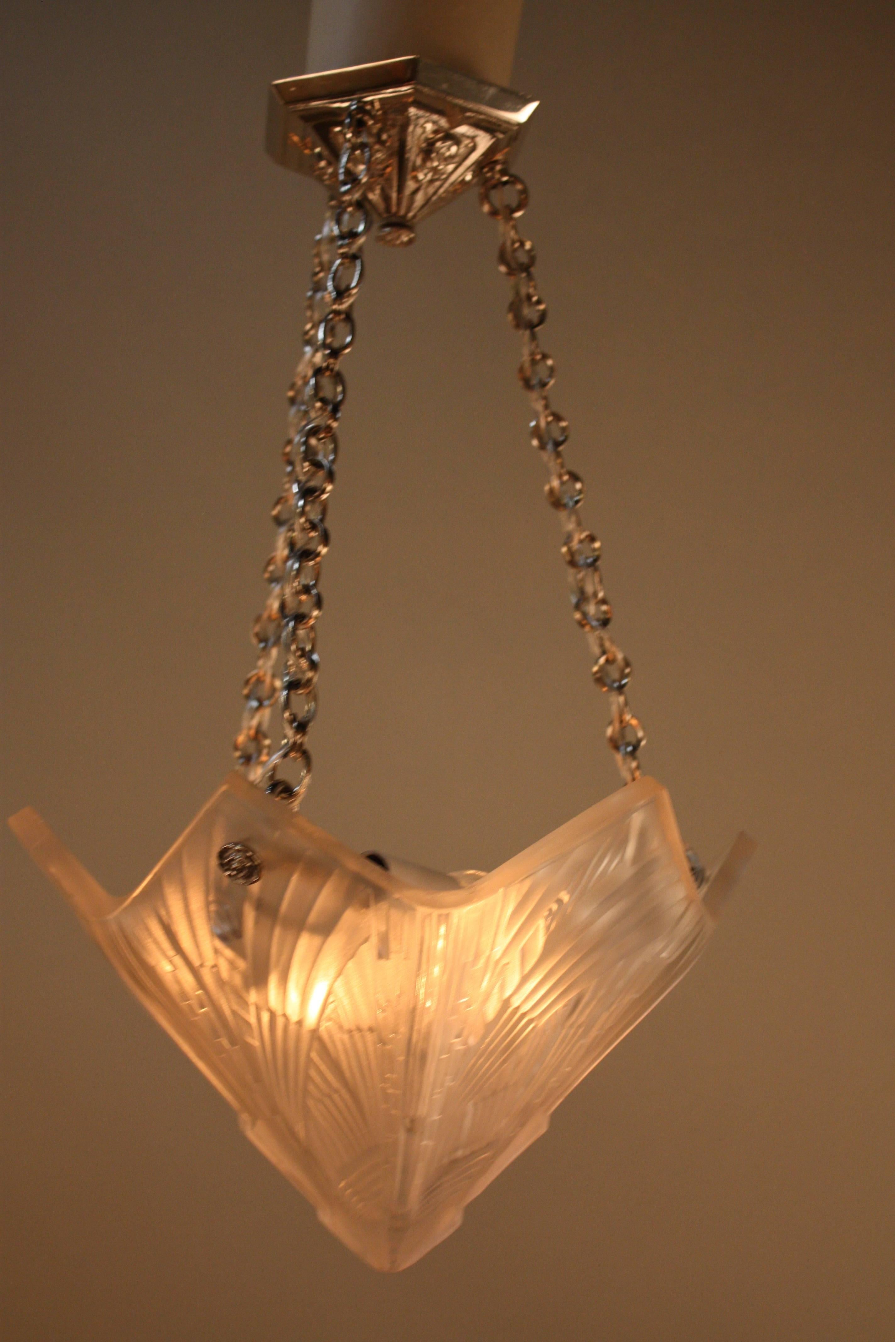 Beautiful Art Deco design glass with nickel on bronze hardware chandelier.
Six-light, 60 watt max each.
