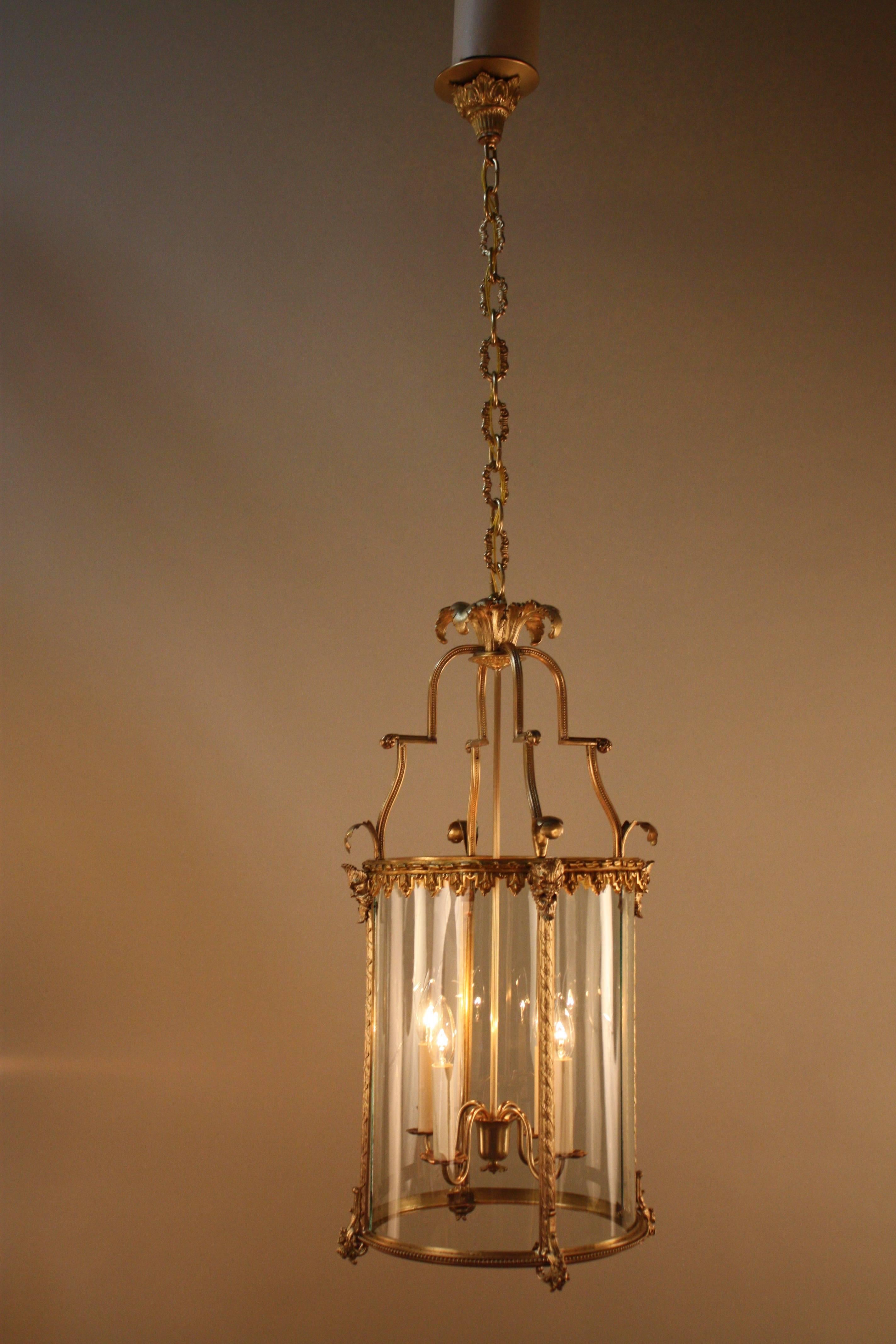 Elegant four-light early 20th century French bronze lantern.
Minimum height fully installed with one link of chain and canopy is 36