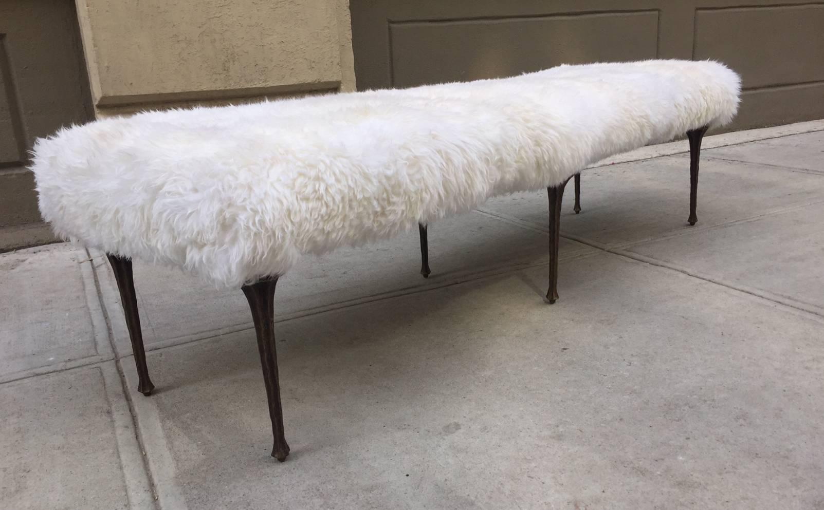 Six-leg bronze bench upholstered in long haired sheep fur by Marc Bankowsky. 