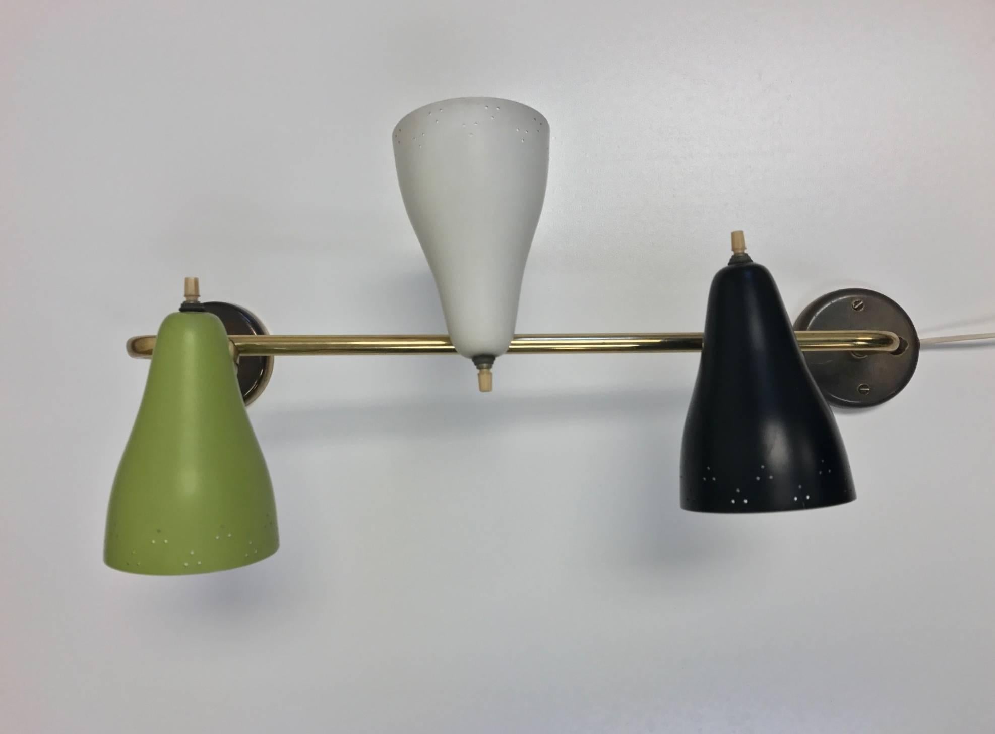 Italian Mid-Century Modern three Globe sconce. Green, white and black painted metal shades with brass angular frame. Globes are Directional. 