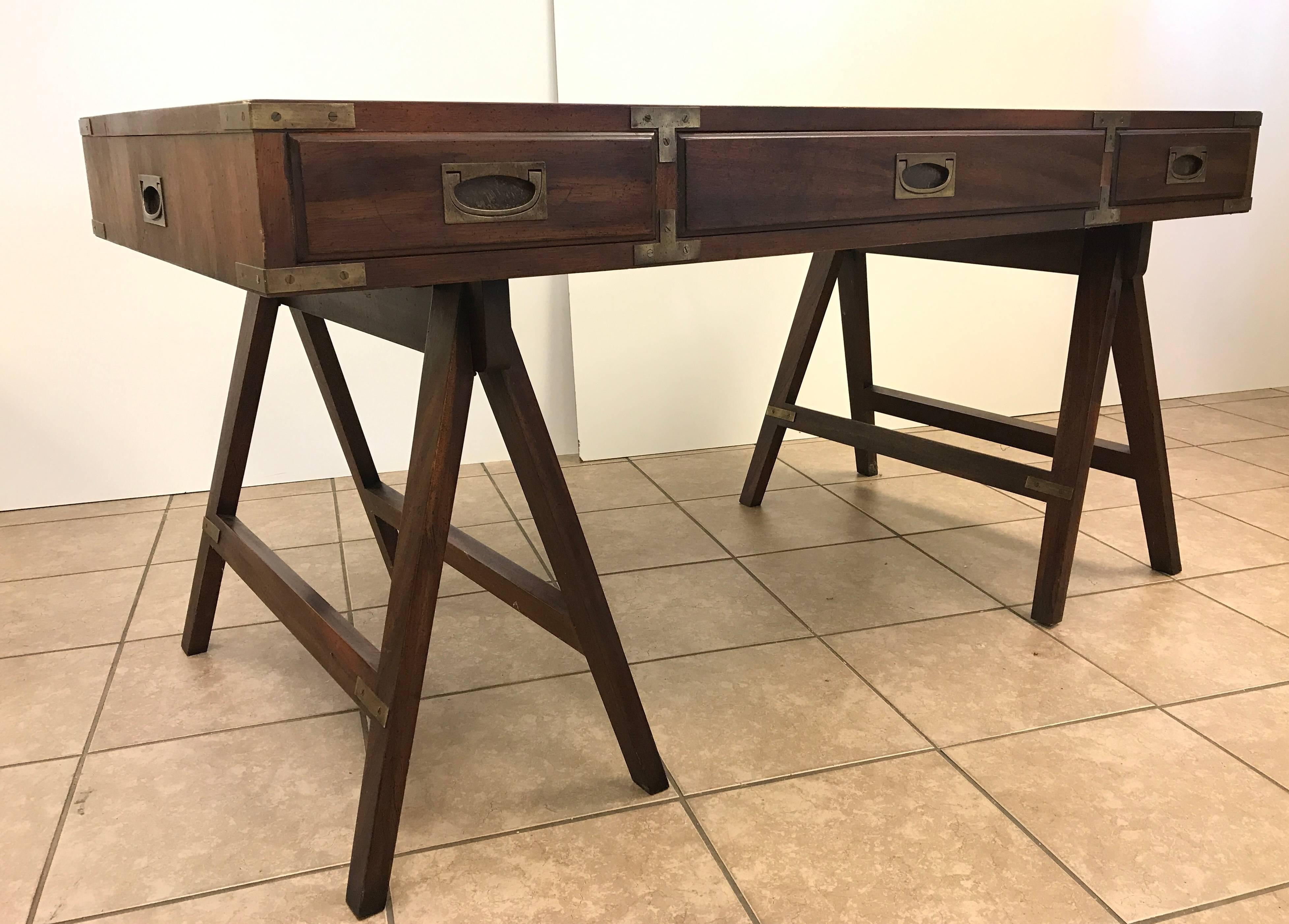 Rosewood and brass Campaign desk with leather top. Has three pull-out drawers and original brass handles. 