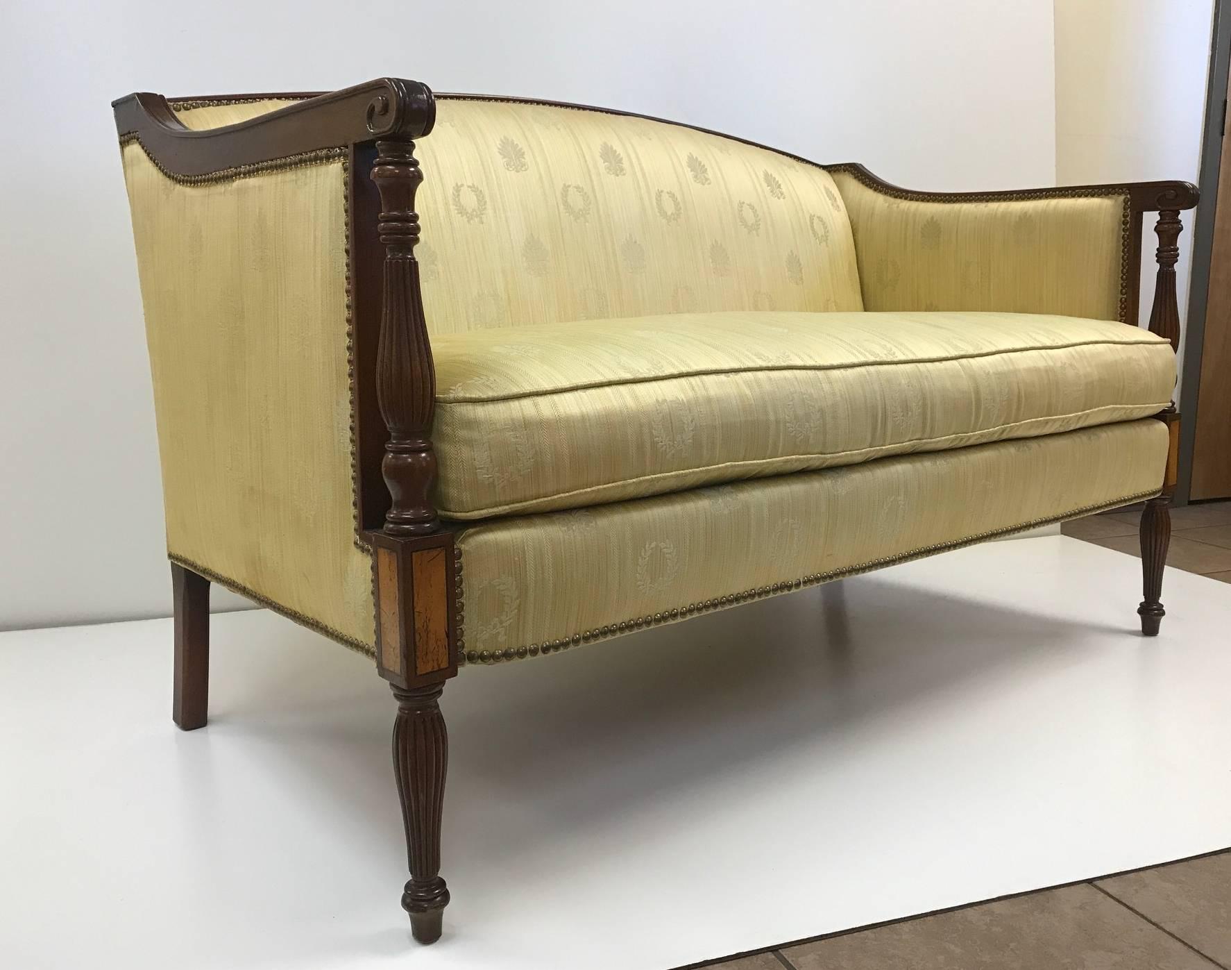 Pair of mahogany Sheraton style sofas, solid mahogany frame and original upholstery.