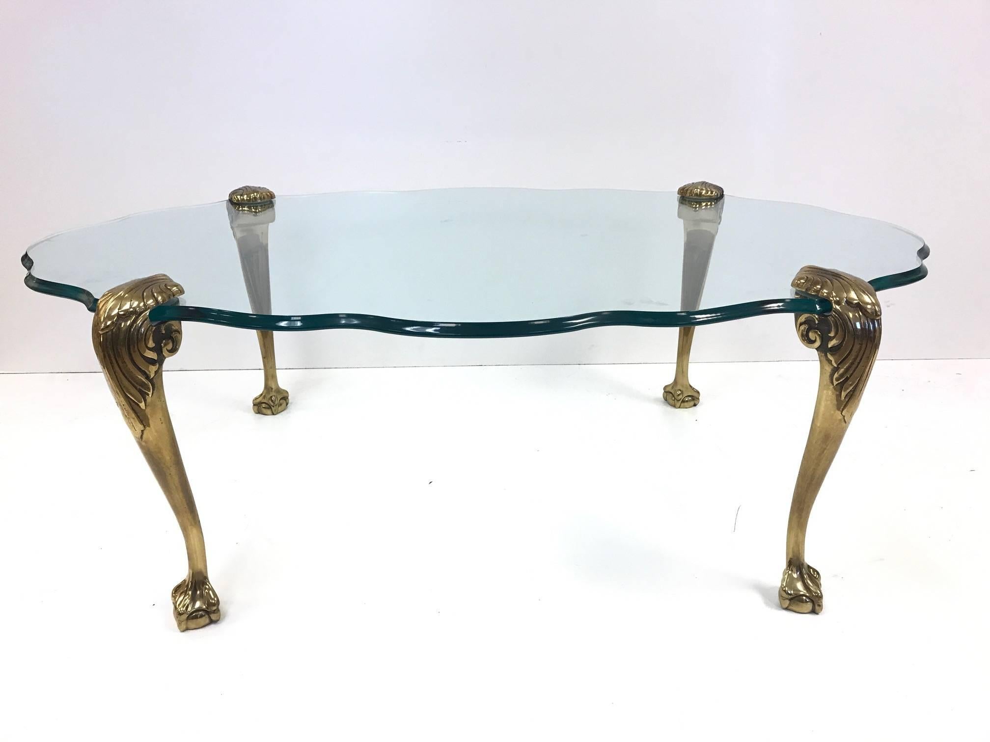 glass coffee table with brass legs