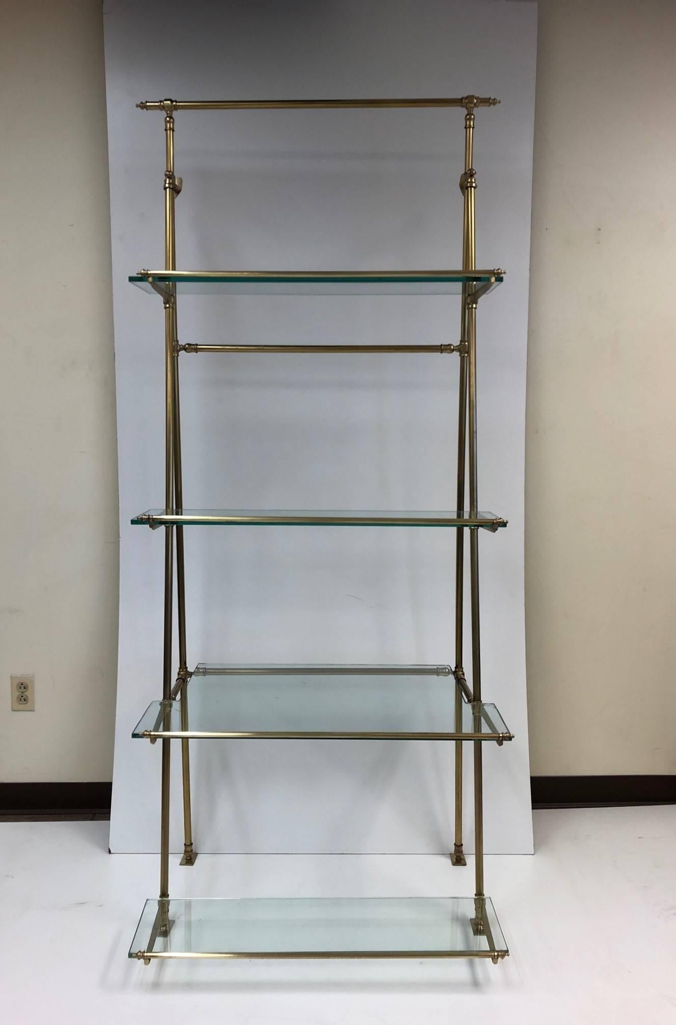 1950s French bronze wall-mounted and freestanding Etagere with glass shelves. Has four glass shelves. Can be mounted to the wall or floor. Very sturdy freestanding.