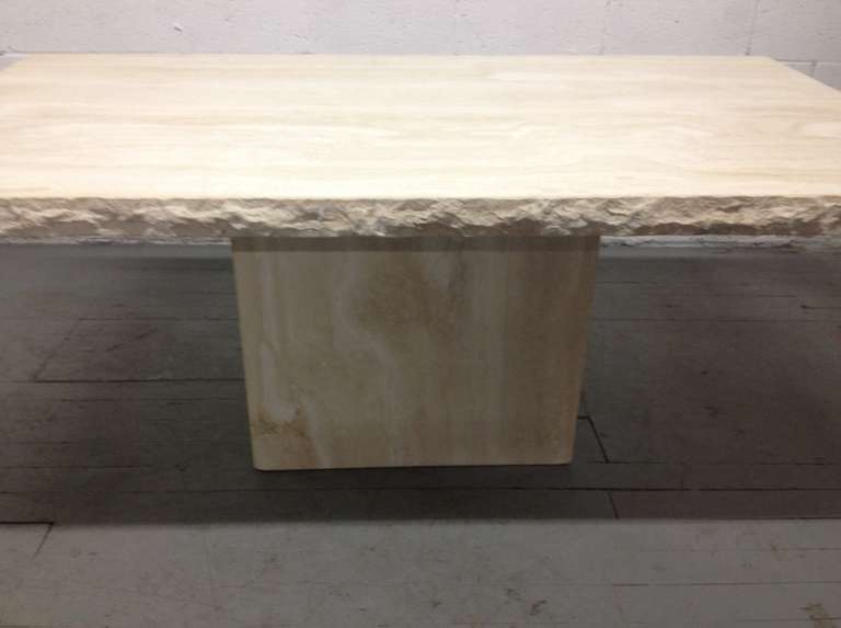 Large Italian travertine table or dining table. The top and the base has a smooth finish. The edges of the top is rough. Can also be used as a conference table.