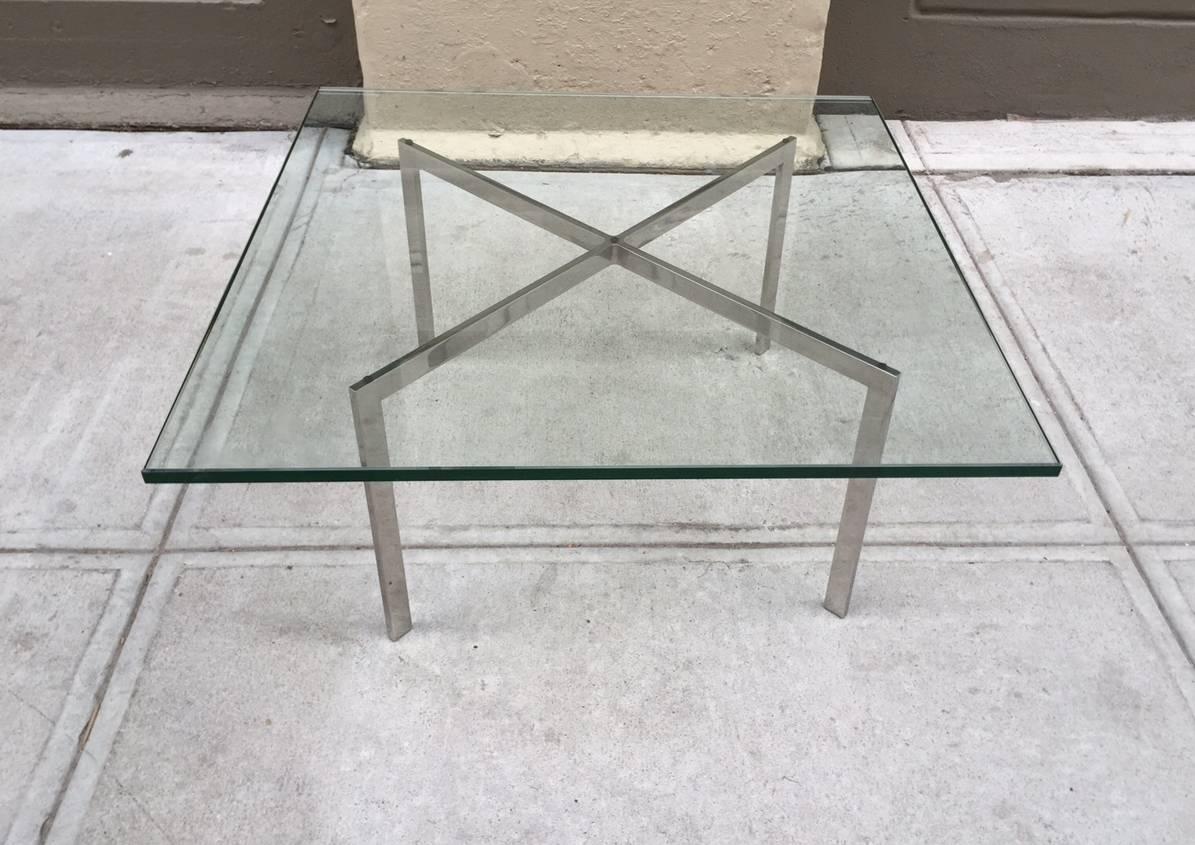 Barcelona table by Mies van der Rohe for Knoll. Original glass.
Measures:  16.25"H x 26.75"W x26.75"D
