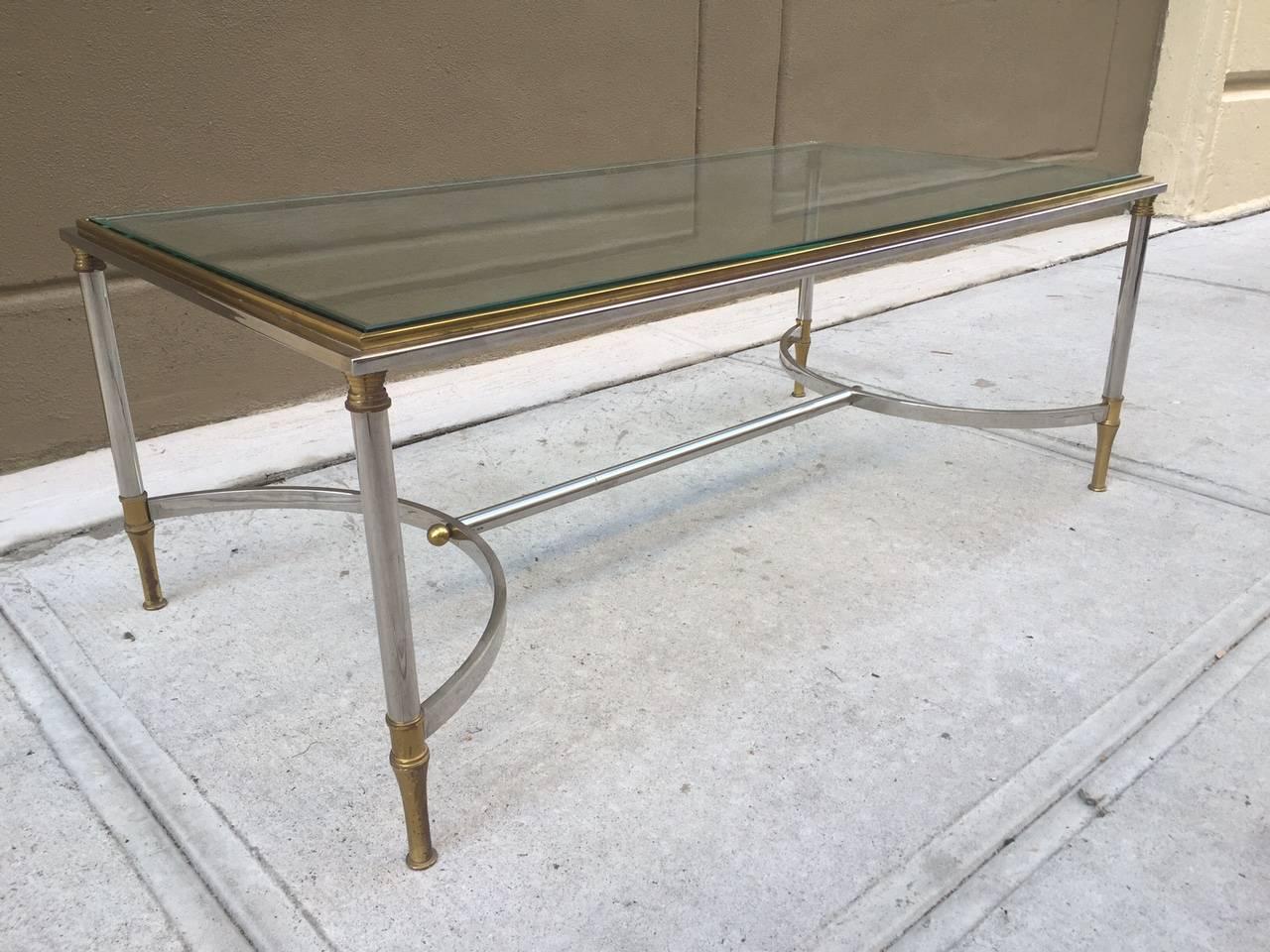 Bronze and Steel Coffee Table style of Maison Jansen. Curved stretcher and glass top.