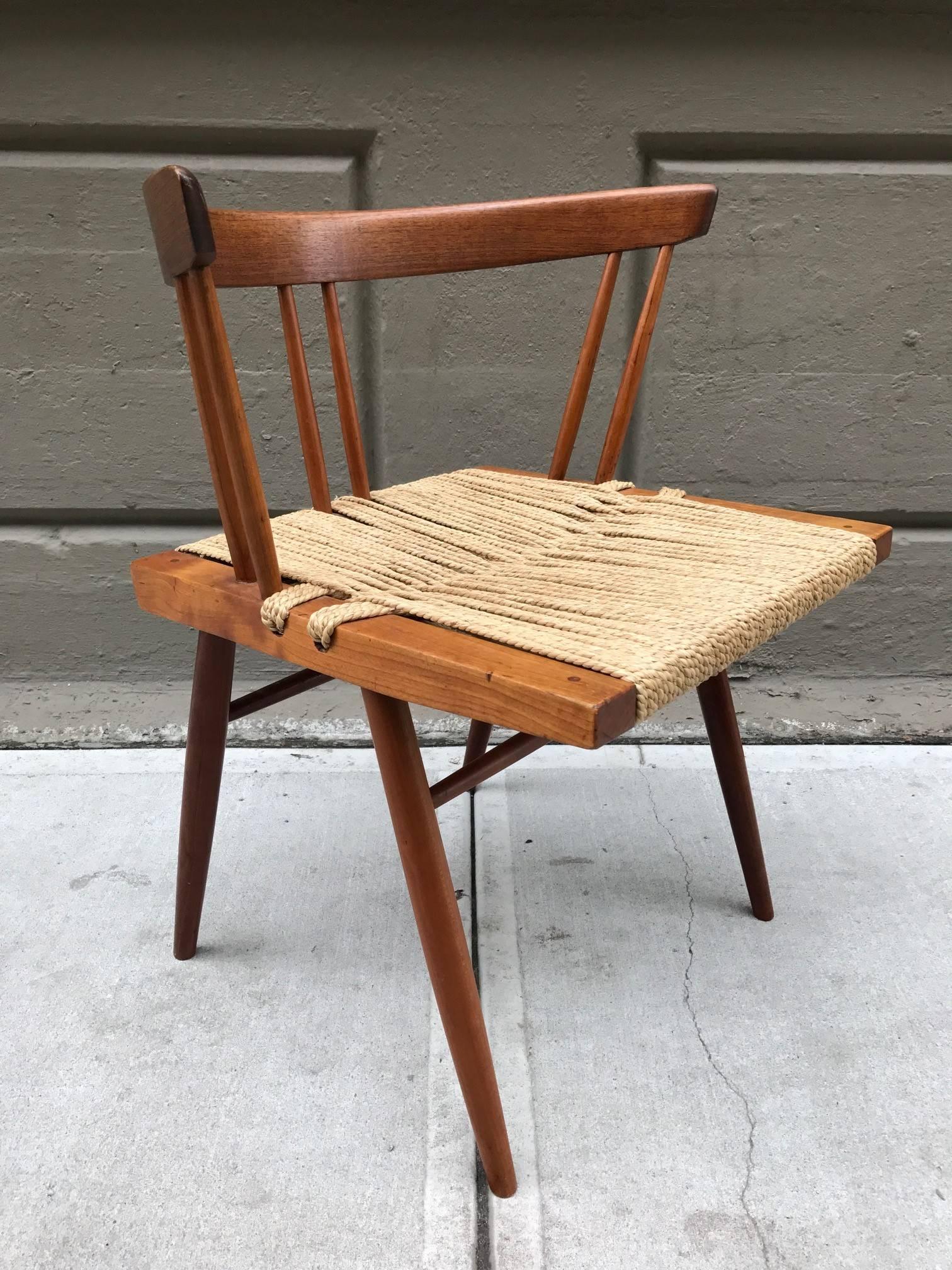 George Nakashima woven grass rope seat chairs with walnut frames.