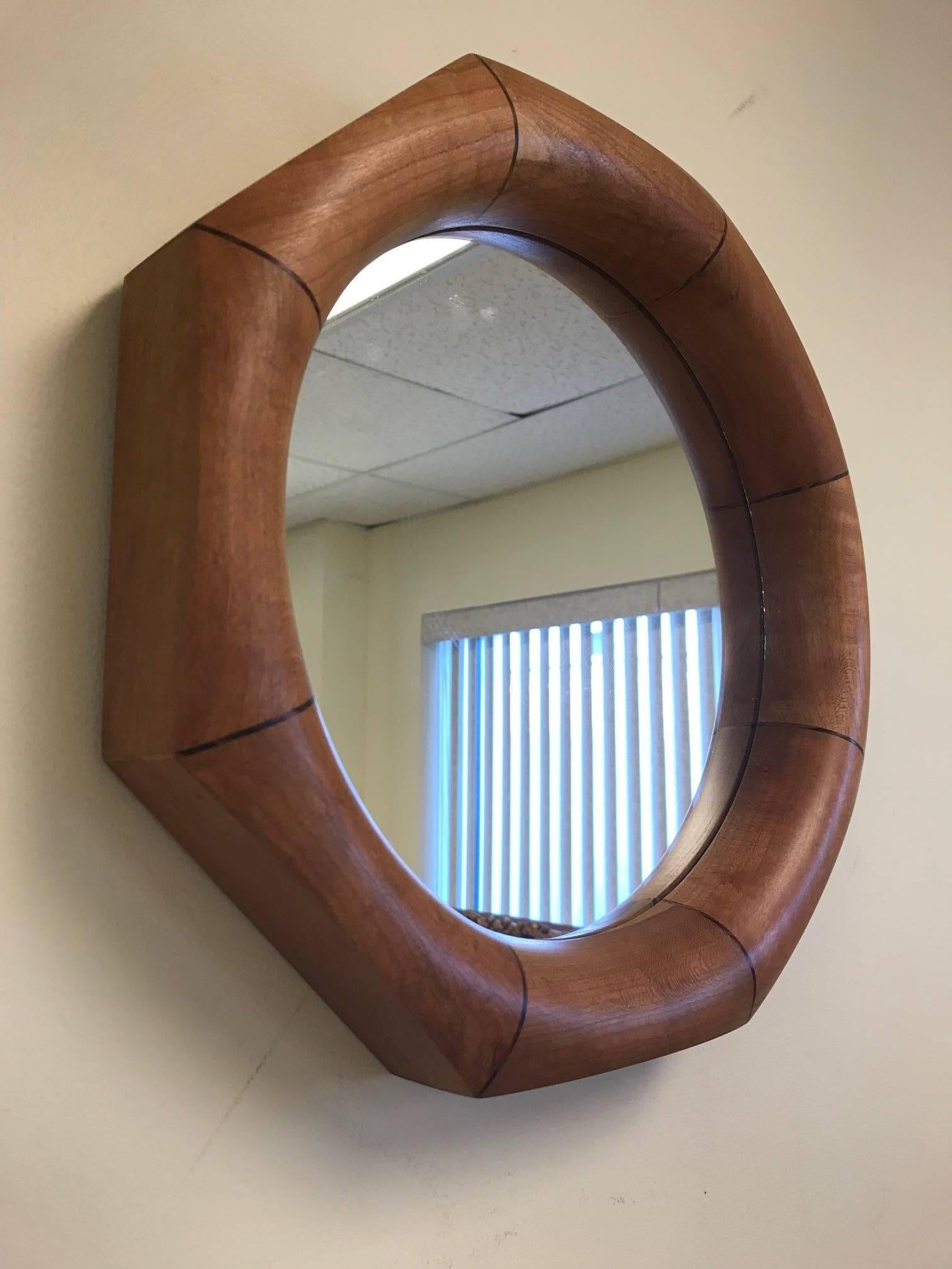 Custom octagonal walnut mirror with rosewood inlay.
The mirror listed is currently available.