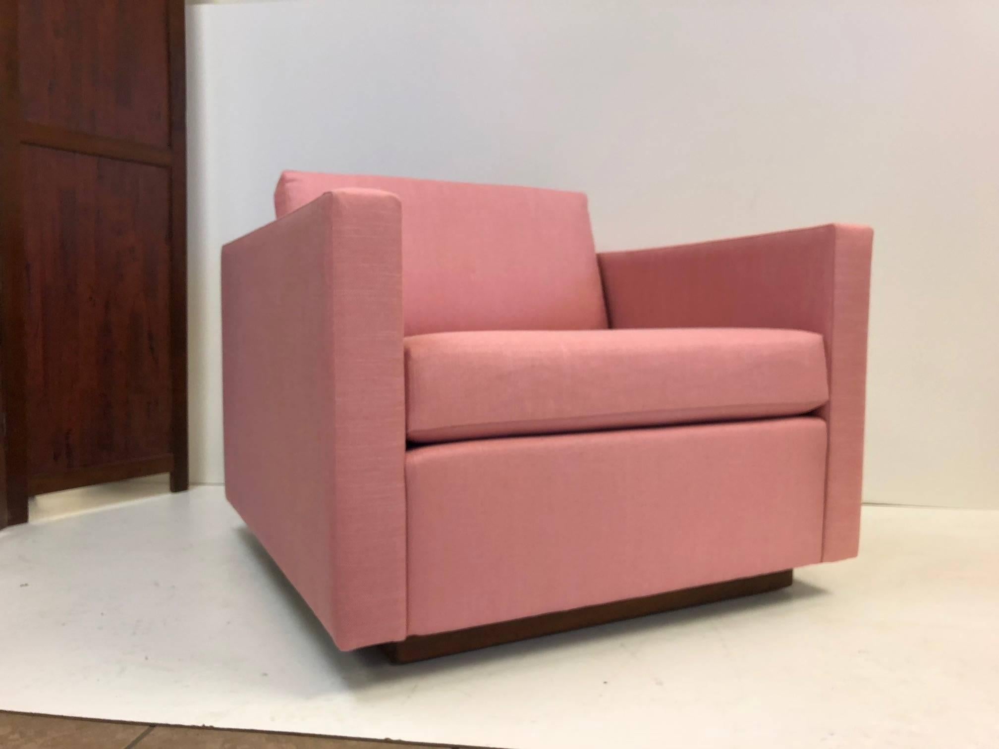 Pair of Harvey Probber cube lounge/club chairs on a solid walnut plinth base. Newly upholstered in a pink linen blend fabric. Retains label.
Measures: 30 H (to back cushion) x 34 D x 32.5 W.
