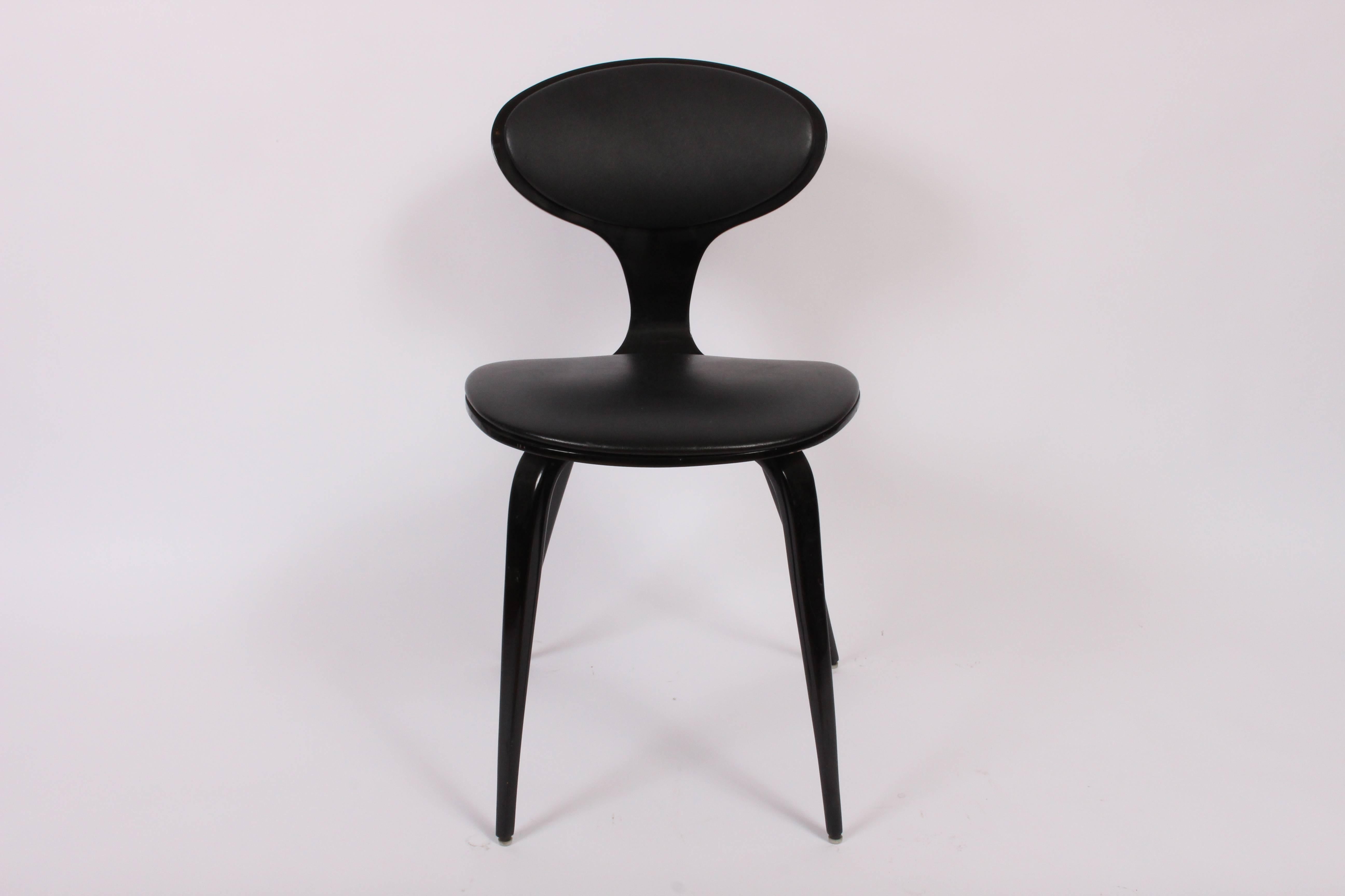 Set of Four Mid-Century Modern Norman Cherner All Black Bentwood Chairs.
Featuring molded plywood Black lacquered frame with cushioned Black vinyl seat and back upholstery. Classic. Elegant. Sculptural. Sturdy. Vintage. Larger Black Lacquered Wood