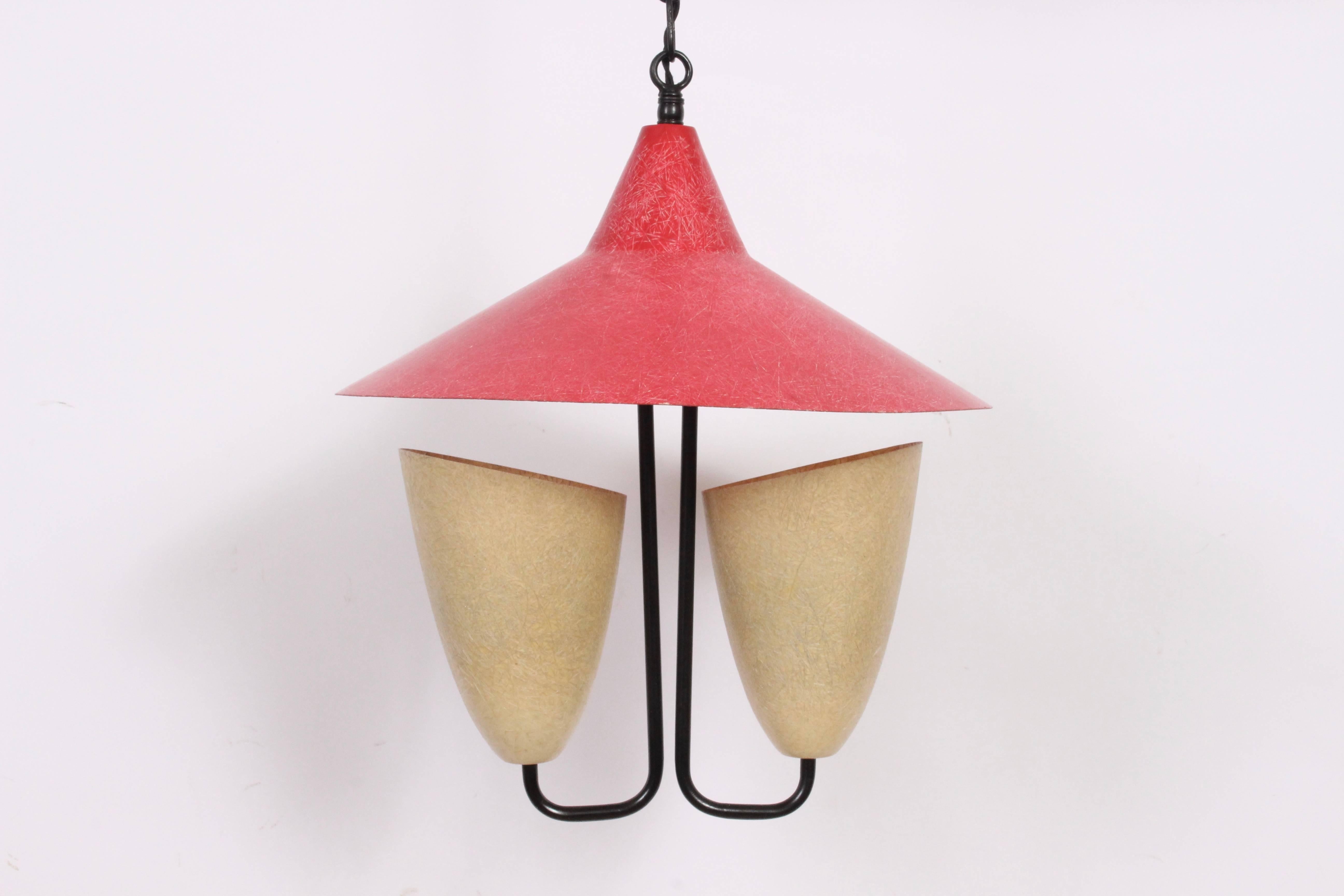 Black enameled Hanging Pendant with Three Fiberglass Shades, 1950's in the manner of Kurt Versen with Greta Grossman influence. Featuring Black enameled Brass framework, a pair of Warm Cream Ivory (8 H x 5 D) cone fiberglass shades detailed with