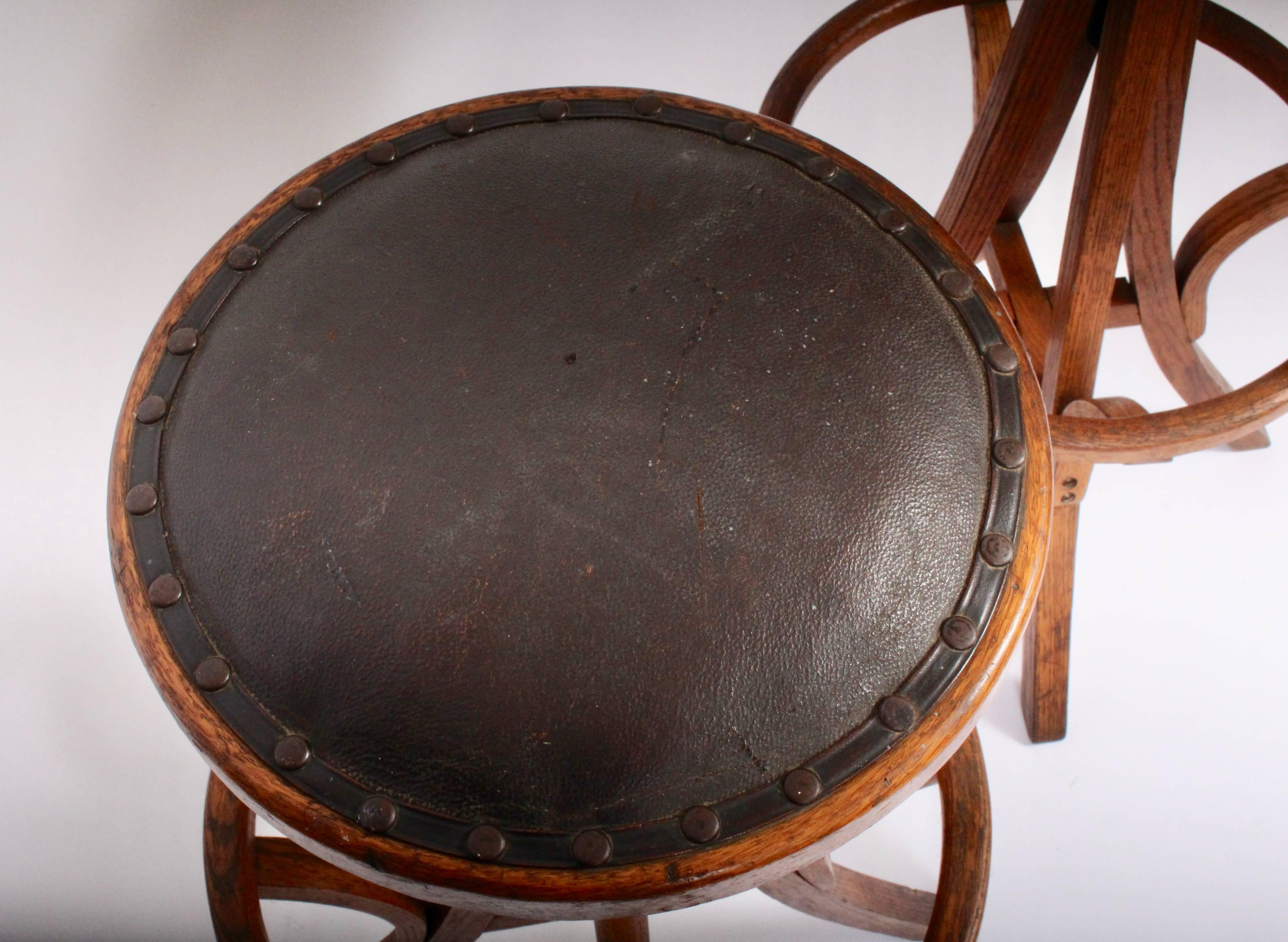 American Pair of Oak & Leather Architect Swivel Stools with Heel Ring, Circa 1910  For Sale