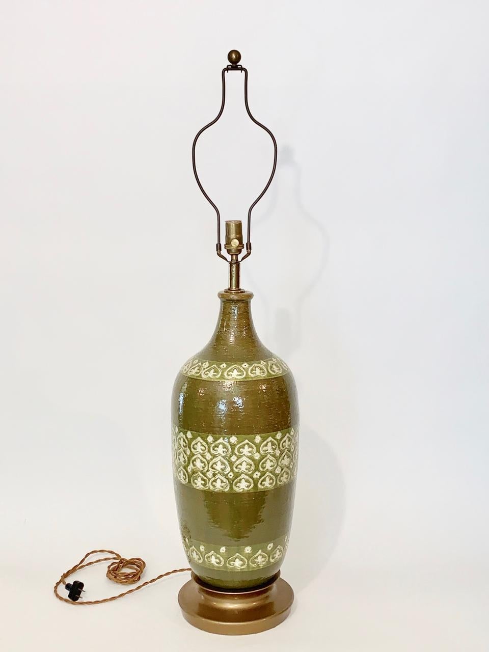 Large pair Aldo Londi for Bitossi Hand Painted Moorish Green Ceramic Table Lamps, 1950's. Featuring a large hand-crafted bottle form with banded, textured hand decorated design in Cream and Spring Green against a reflective Olive Green, Army Green