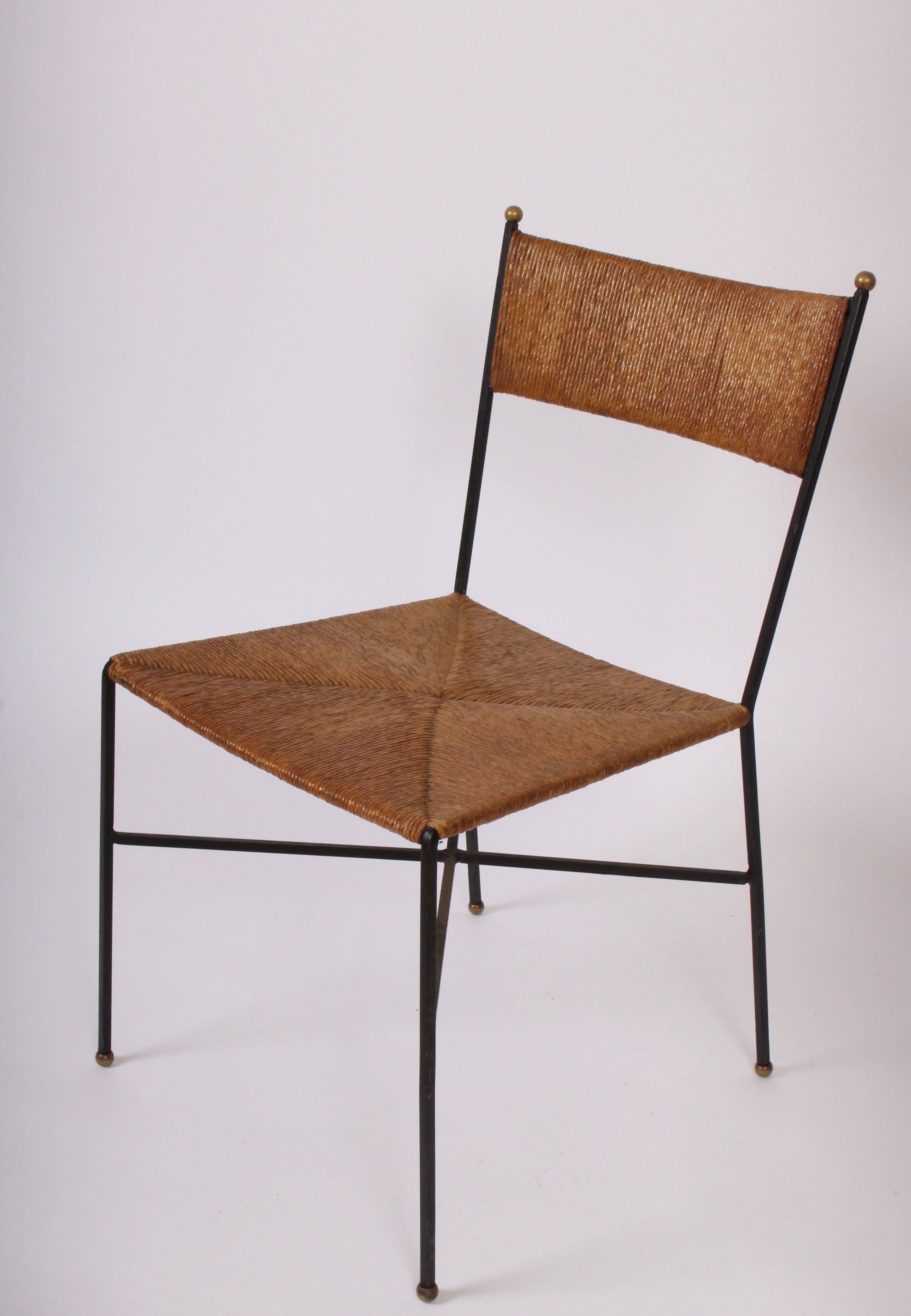 Milo Baughman for Murray Furniture wrought iron and rush side chair, circa 1954. Featuring a rounded rush back, rush seat, wrought iron frame with criss cross supports and brass ball details. Very good vintage condition. Comfortable. Versatile.