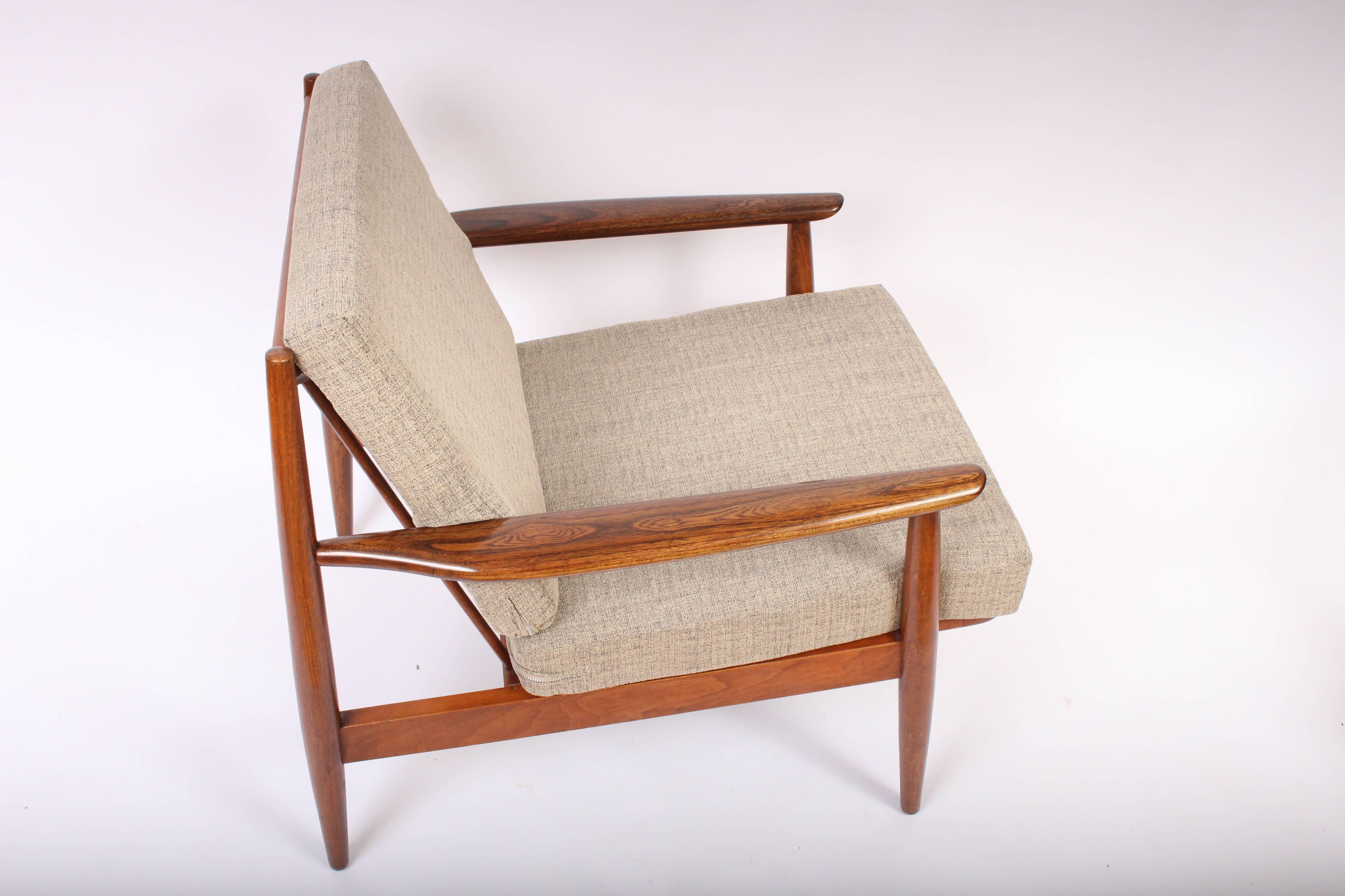 American Mid Century Viko Baumritter for Baumritter of New York Wide Walnut Lounge Chairs. Featuring a Spindle back, sculpted armrests, dowel legs and new webbing. With newly upholstered reversible cushions in a neutral Oatmeal, Buckwheat fabric.