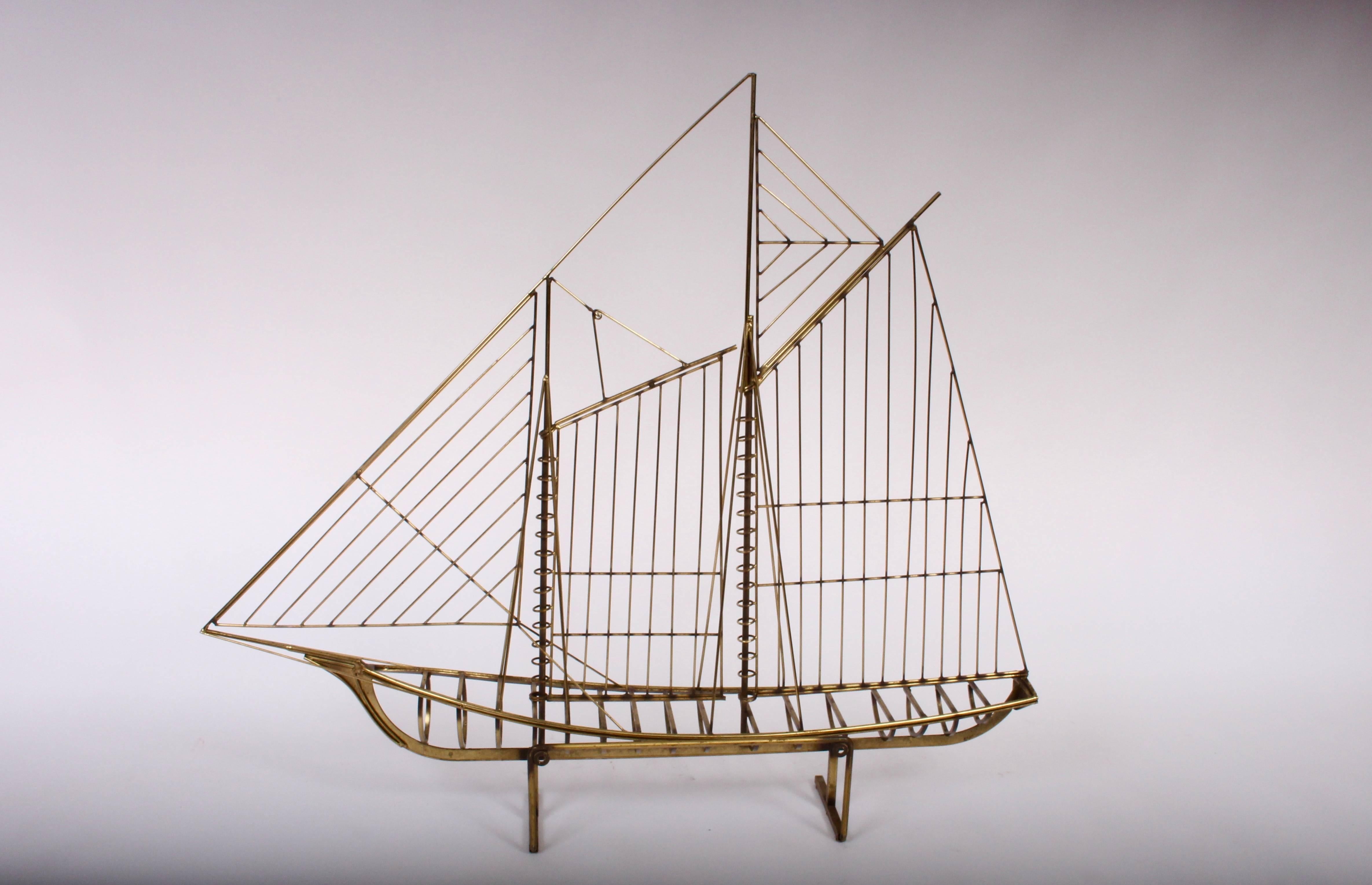 Signed early version C. Jere 1976 Brass Wire Yacht Sculpture, Brass Sailboat Sculpture by Artisan House. Featuring a one piece three dimensional Sloop in all Brass on a open footed and rectangular Brass base.  Maritime. Nautical. Seafaring. Coastal.