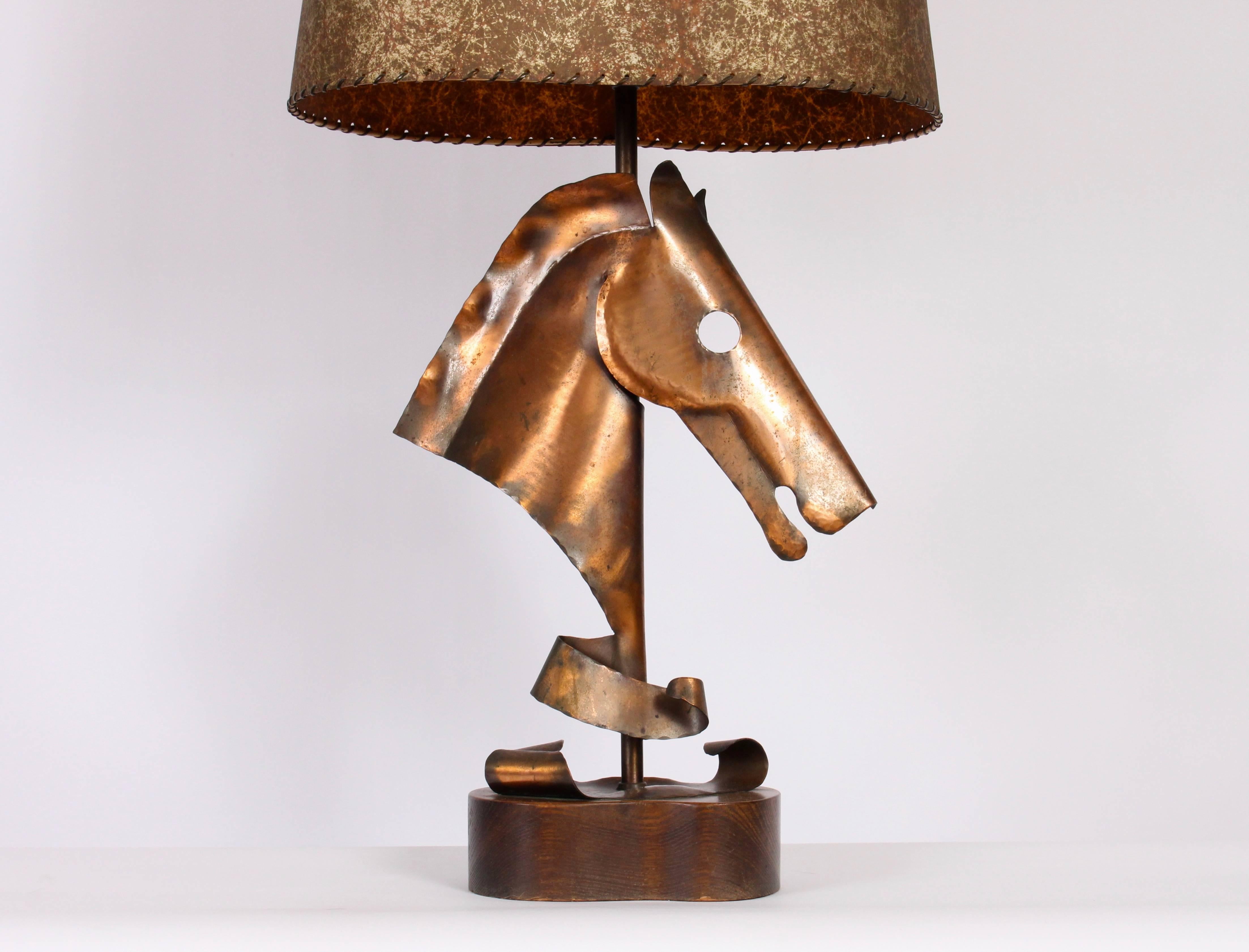 Art Deco Modern Handcrafted Yasha Heifetz Copper and Dark Oak Equestrian Table Lamp. Featuring a handcrafted hammered Copper Horse Head with refinished organic kidney bean Oak base (8.5x 5.5). Original brass socket, harp, finial with new turn
