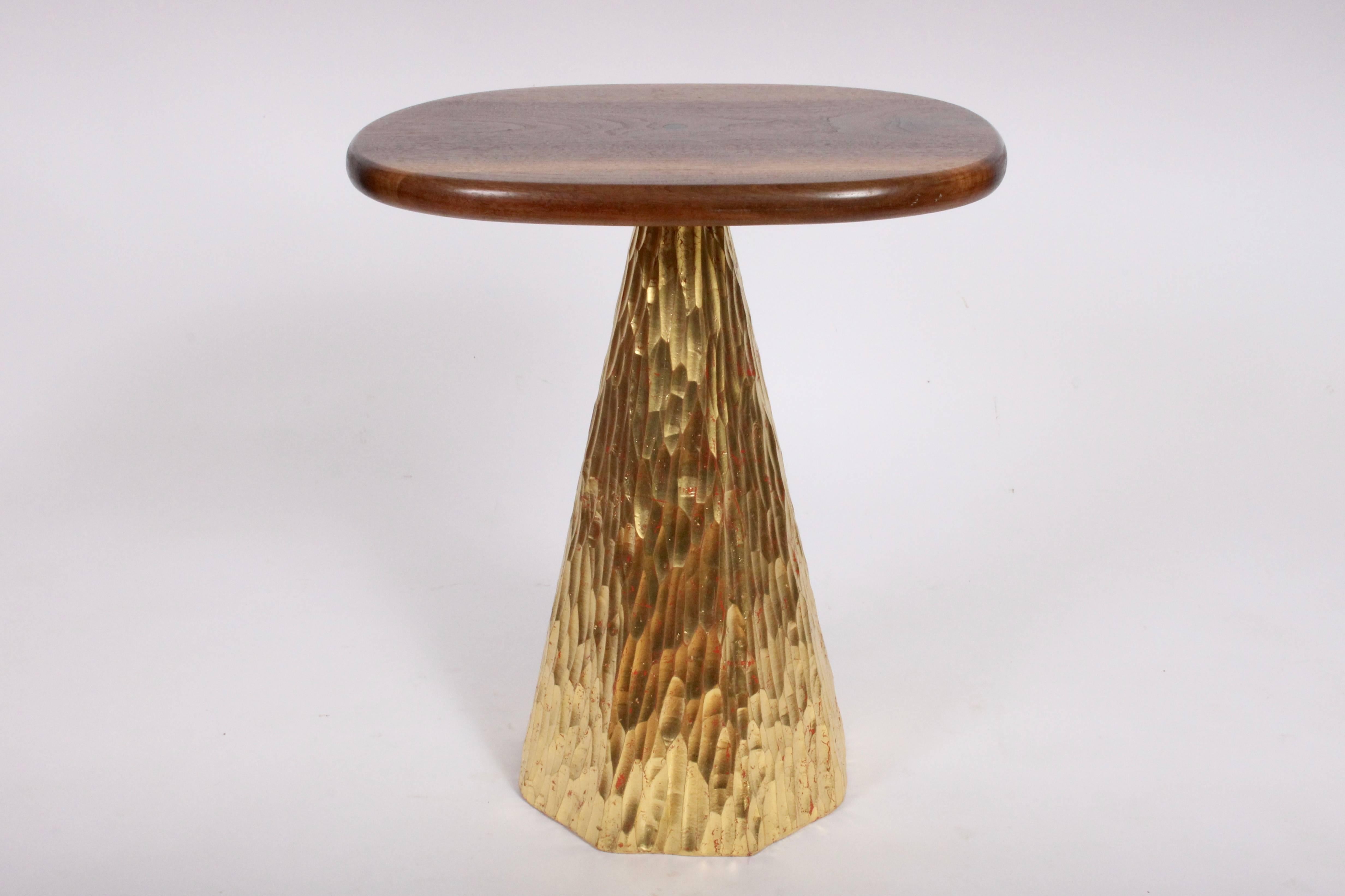 Sculptural Phillip Lloyd Powell hand chiseled, red highlighted Gold Leaf Table with Walnut surface. Featuring a lacquered solid Walnut ovoid surface, Ebony button inlay and hand carved hexagonal wooden base hand painted in Salmon Red and accentuated