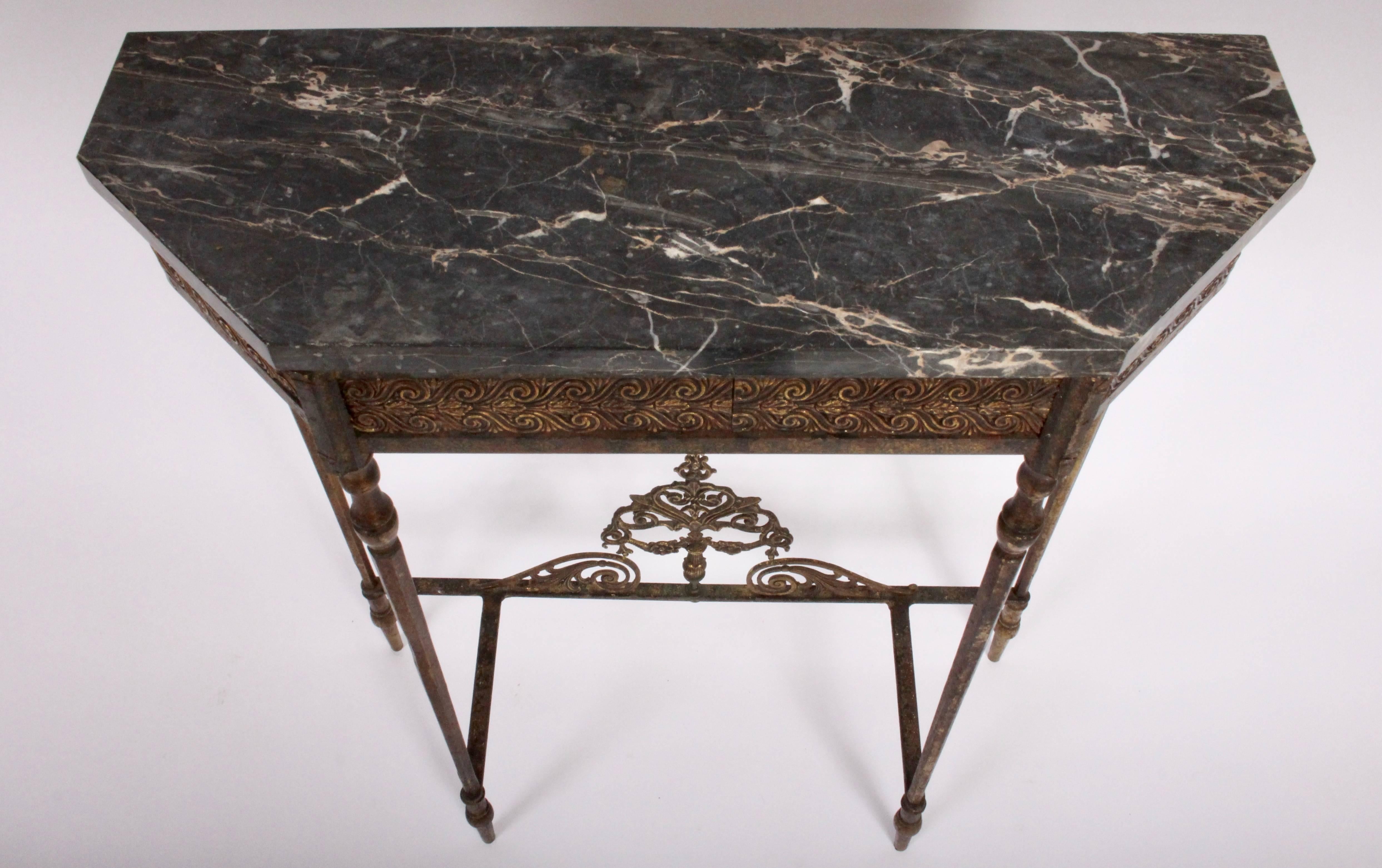 Aesthetic Movement Oscar Bach attributed Occasional Table, Entry Table or Hallway Table. Featuring a rectangular iron framework with Bronze scrolled apron, tapered legs and lower scroll design and Dark Grey Marble top. Lightly restored.