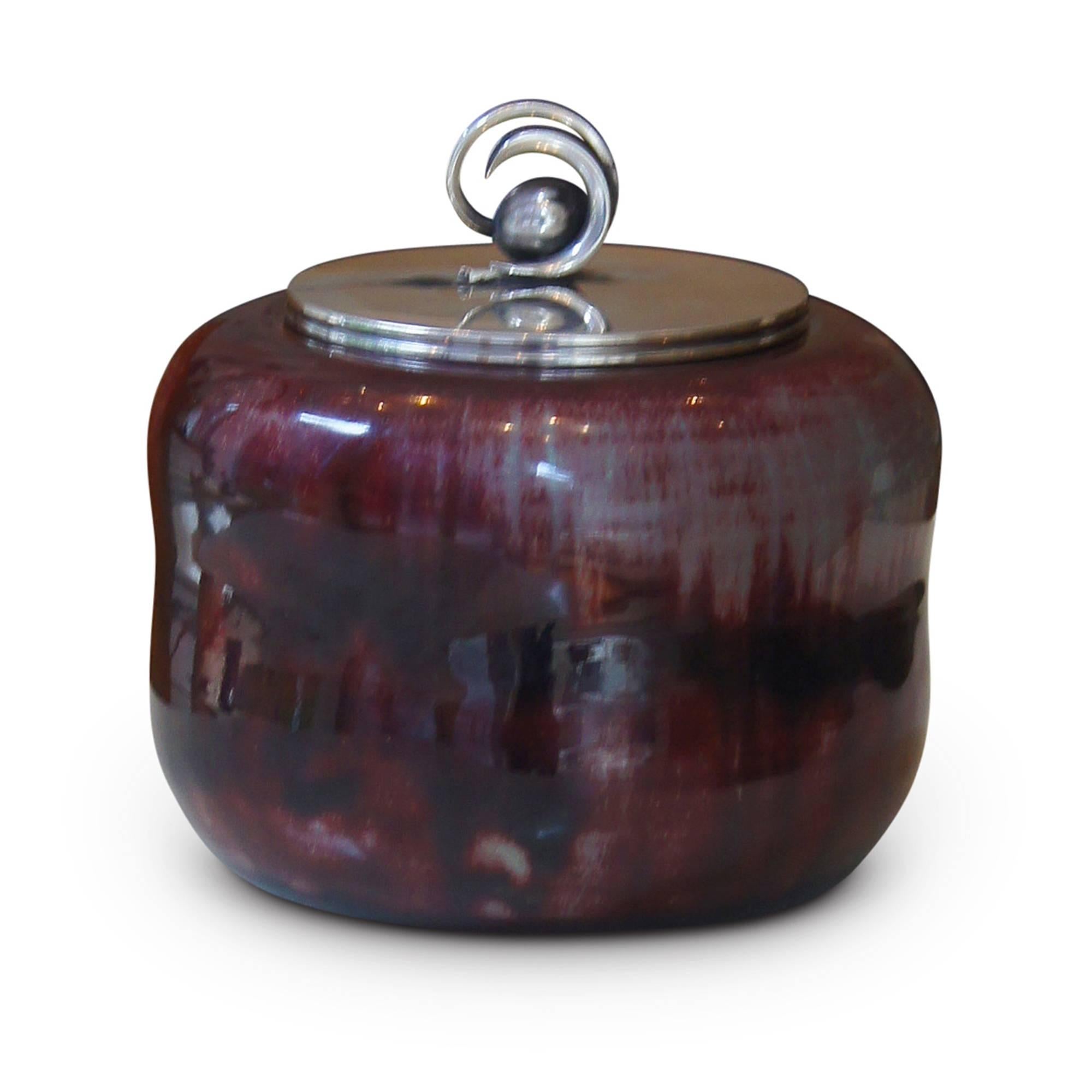 Exceptional and unique Art Deco lidded stoneware jar with and elegantly undulating Silhouette by Carl Halier (1873-1948) for Royal Copenhagen, in stoneware with an uncommon and strikingly vibrant and painterly oxblood/celadon glaze combination, with
