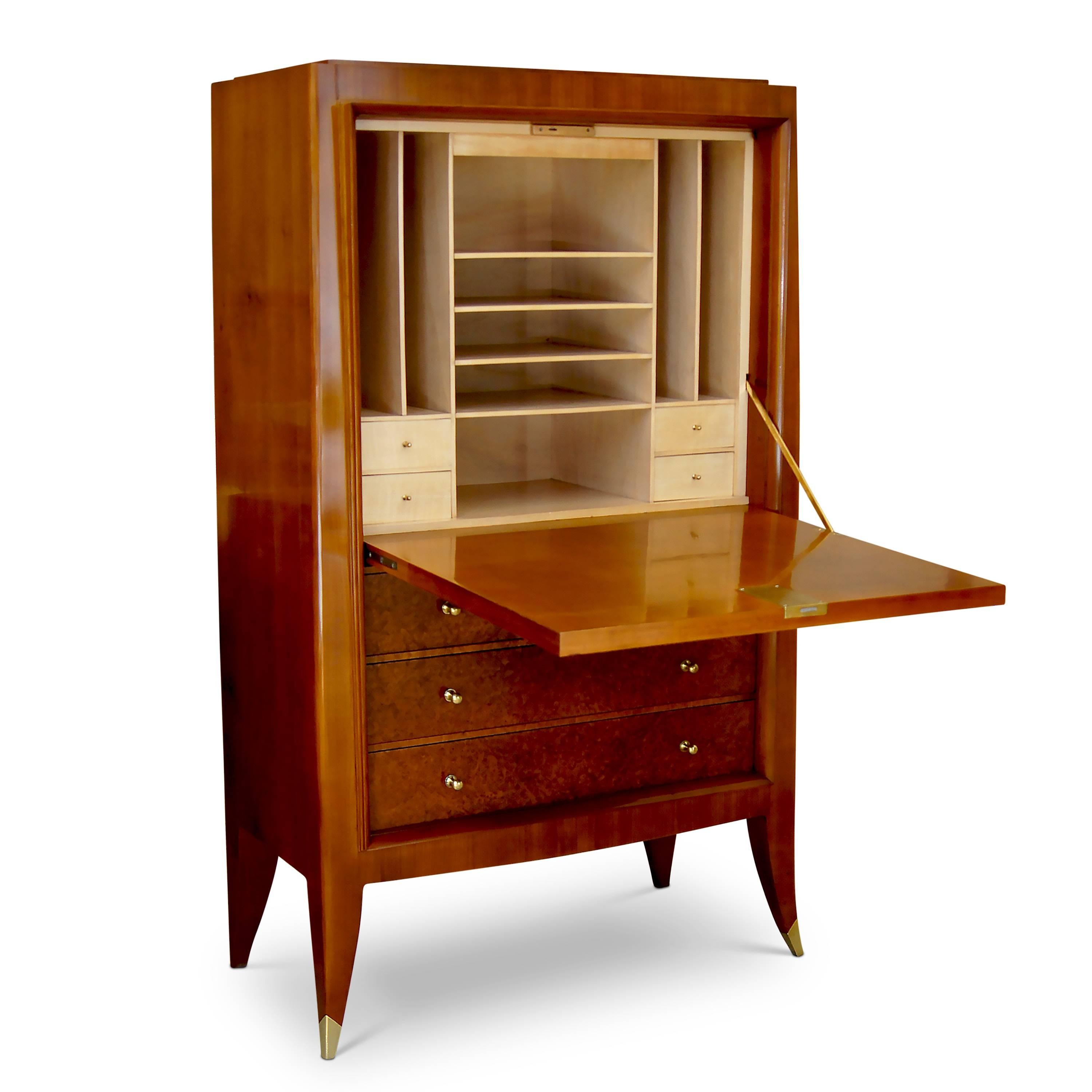 Fine cabinet (forming an original custom set with a storage cabinet, also available) by Alfred Porteneuve (1869-1949). The sculptural case-piece is superlatively crafted in fruitwood (likely cherry) with amboyna (burl walnut) veneer on the doors. A